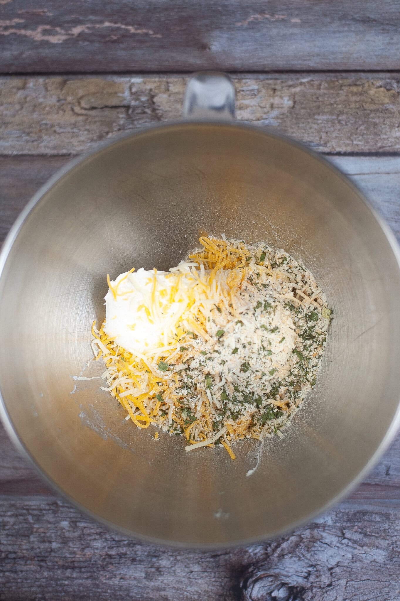Mixing in ingredients to create homemade ranch seasoning in a bowl