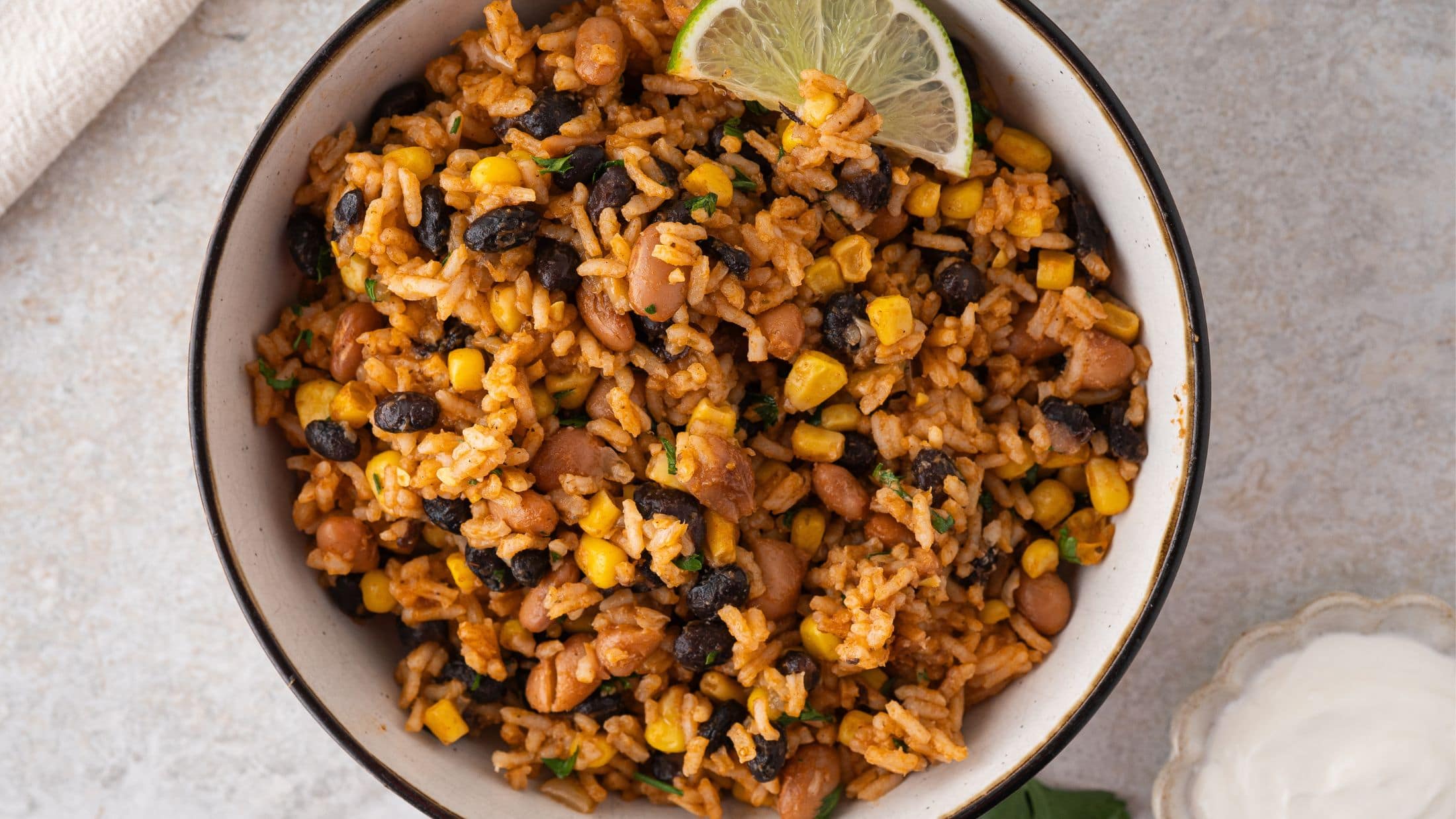 Mexian Rice and beans served up in a bowl ready to be enjoyed