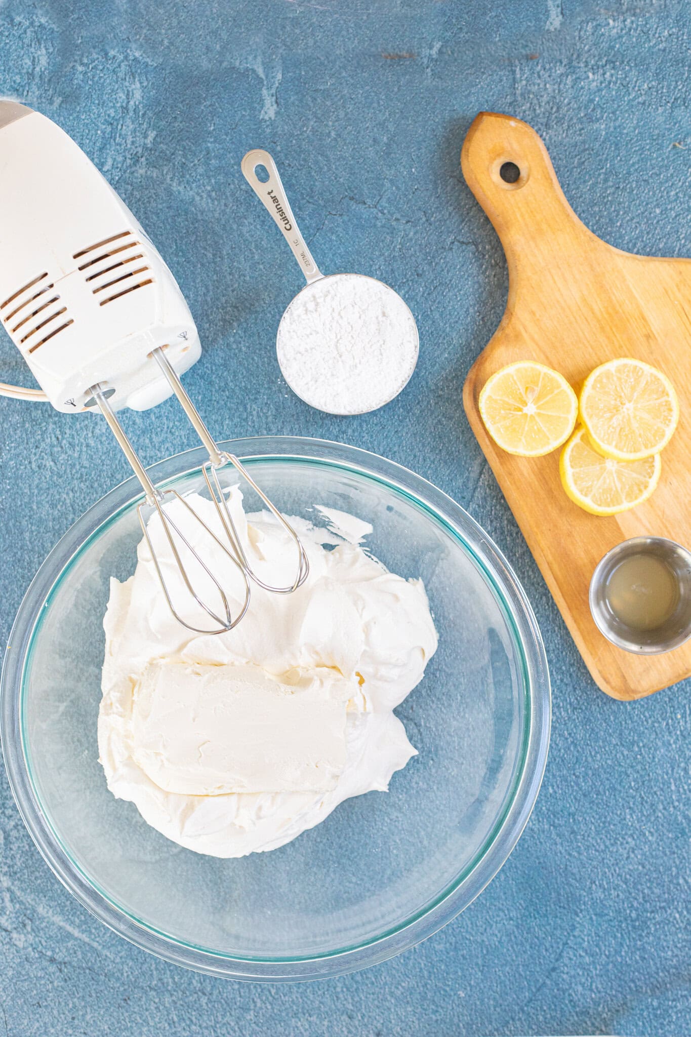 Mixing the cream cheese and cool whip together in a large bowl