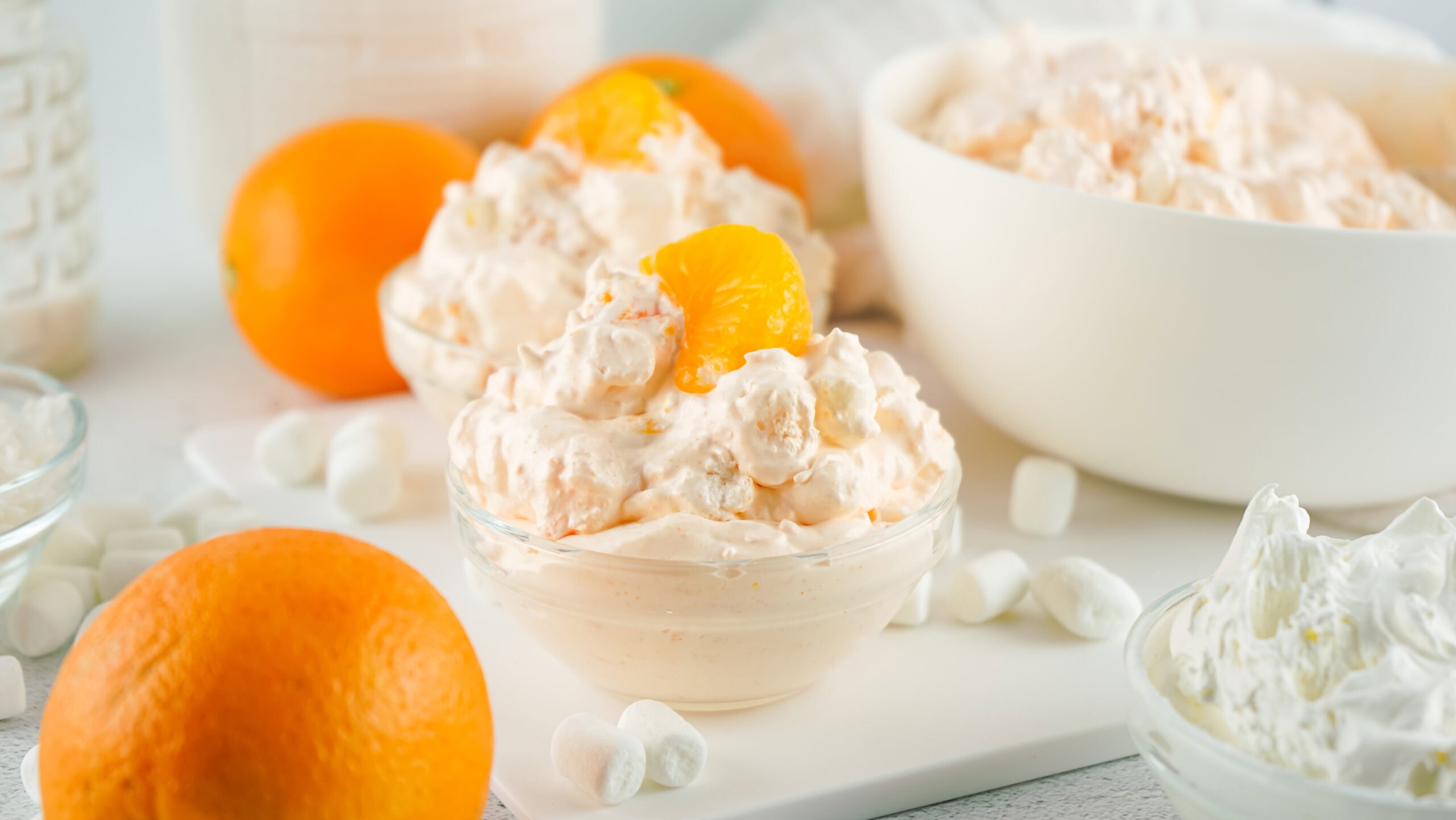 Served orange fluff salad in a bowl, ready to be eaten.