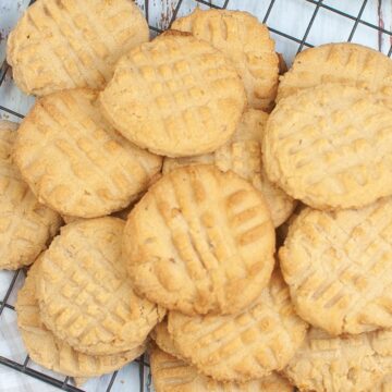 a close up of air fryer peanut butter cookies on a wire rack
