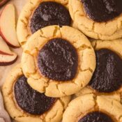 a close up of apple butter thumbprint cookies