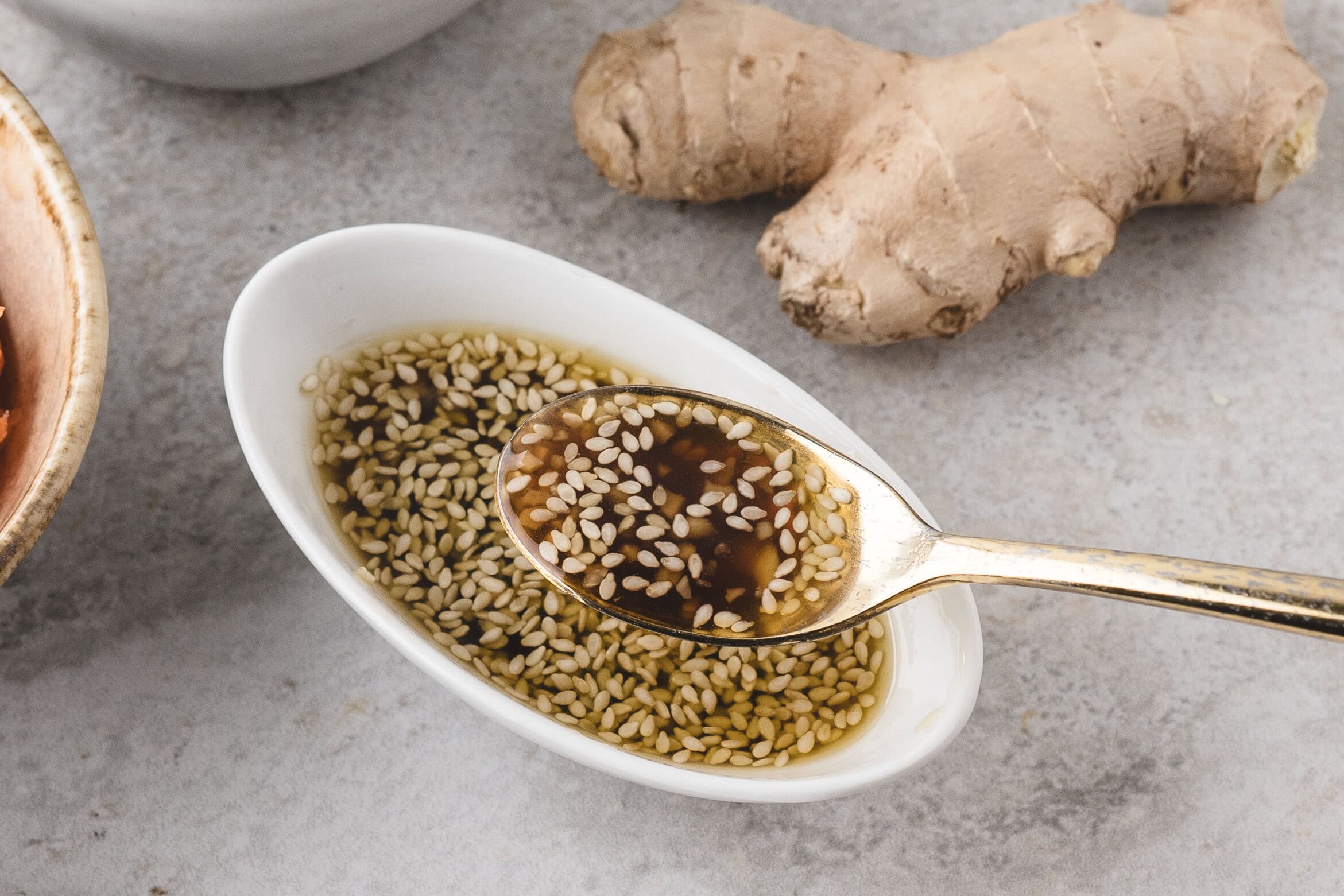 Spoonful of sesame ginger dressing. Showing it's texture
