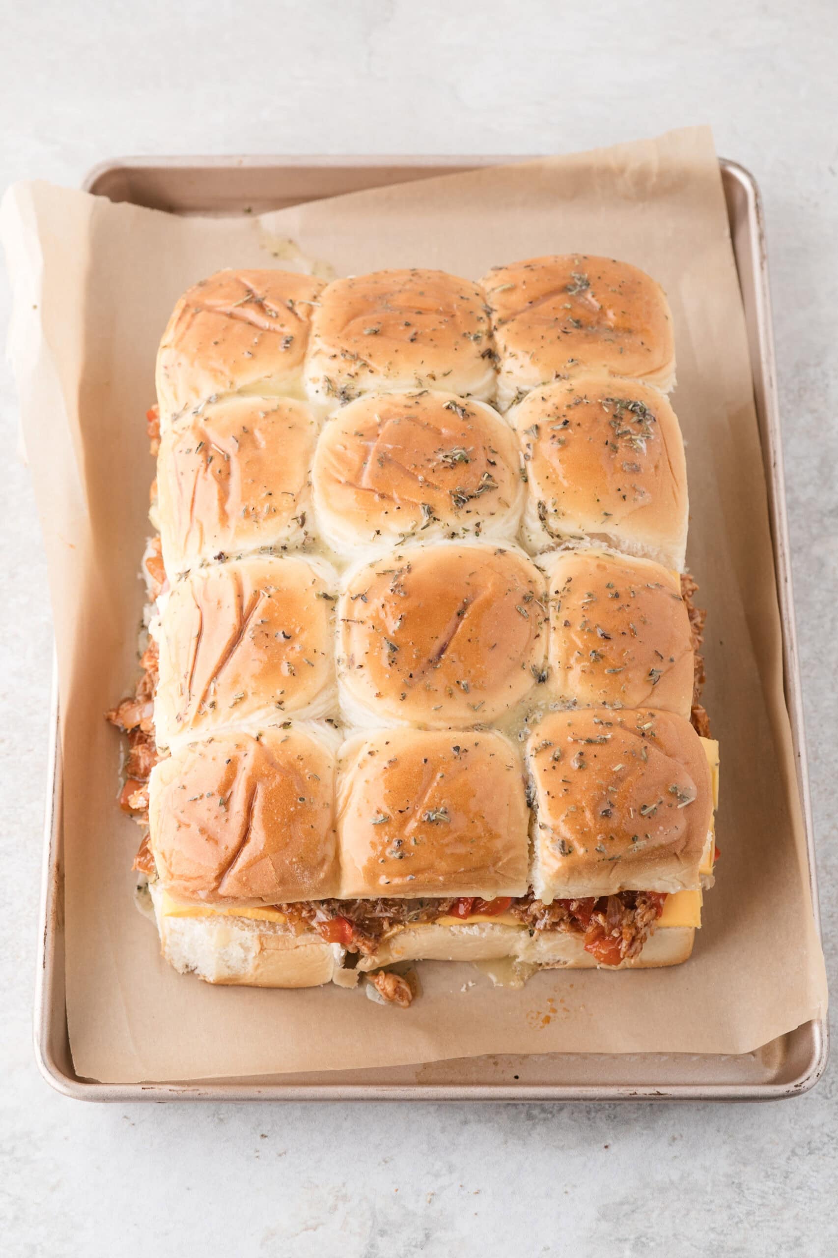 BBQ Chicken sliders are ready to be baked in the oven.