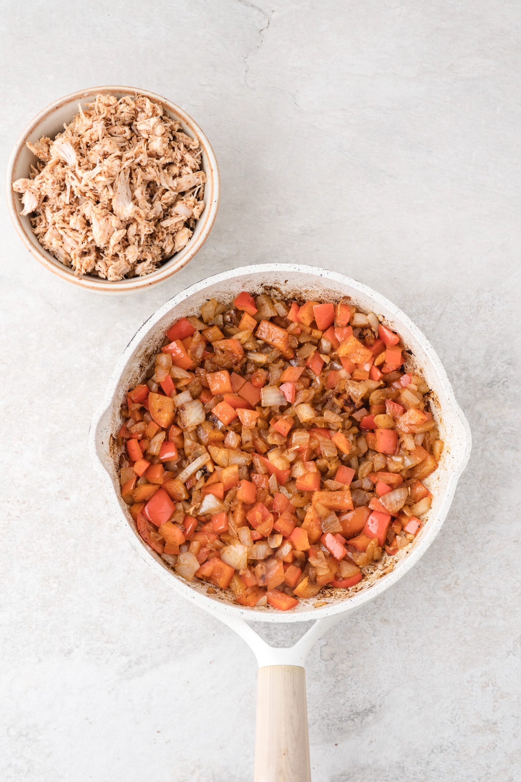 Tomatoes, onions and spices, garlic all cooking in a skillet