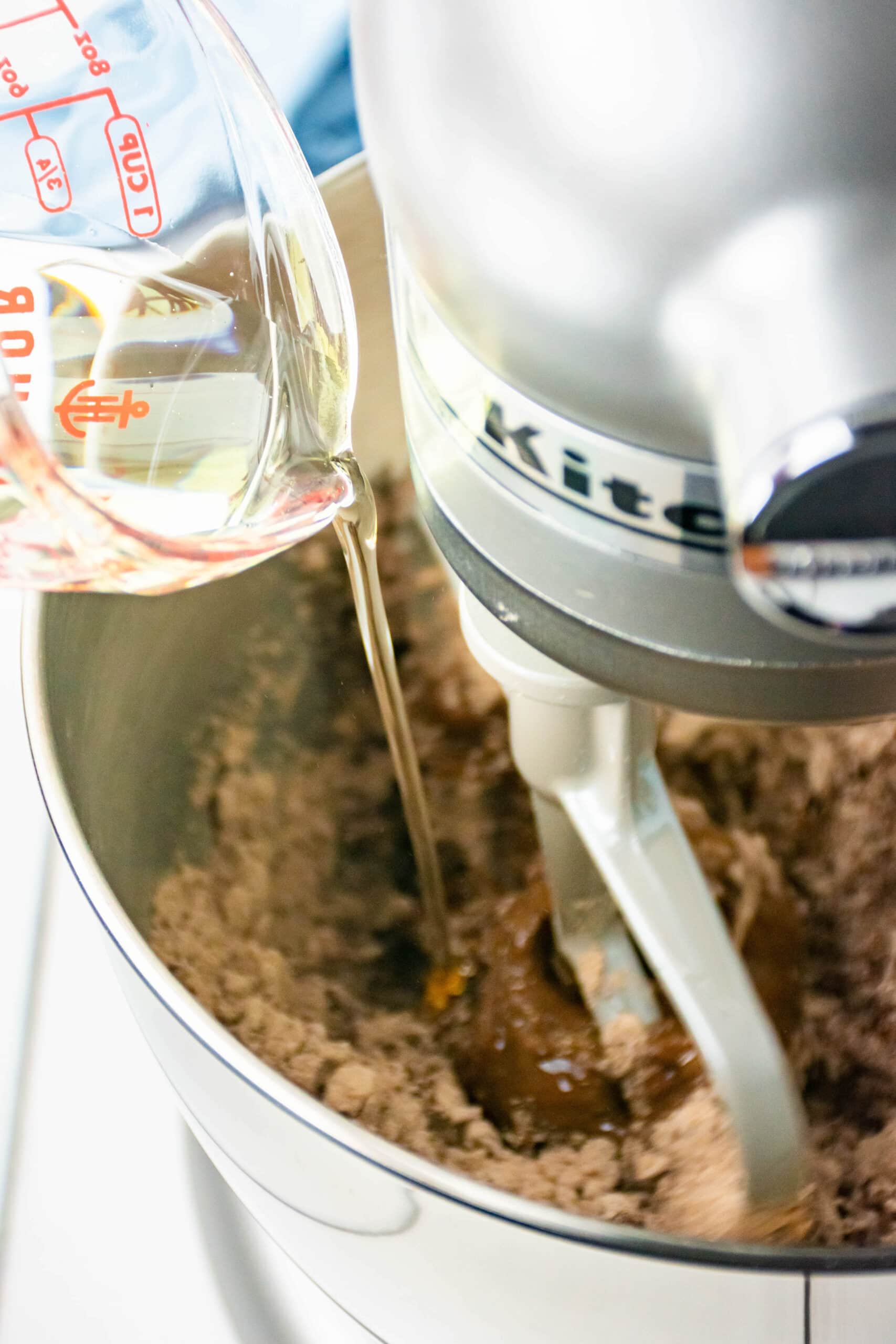 Creating the batter by adding vegetable oil