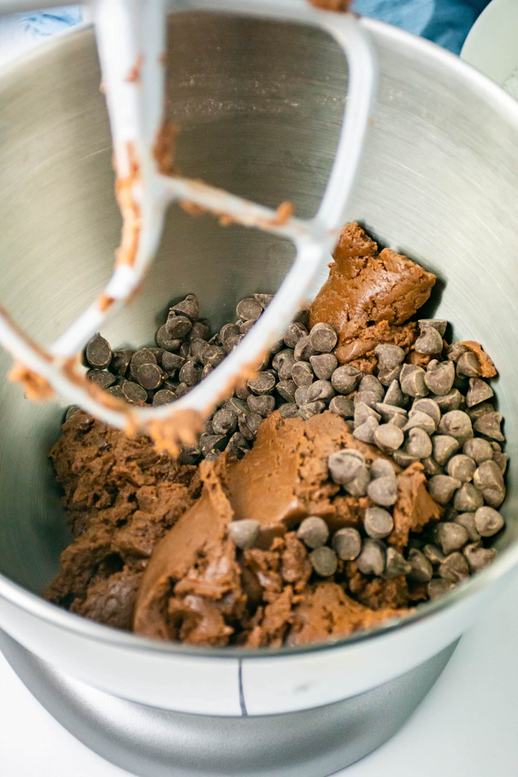Mixing in the chocolate chips into the batter to finish the batter.