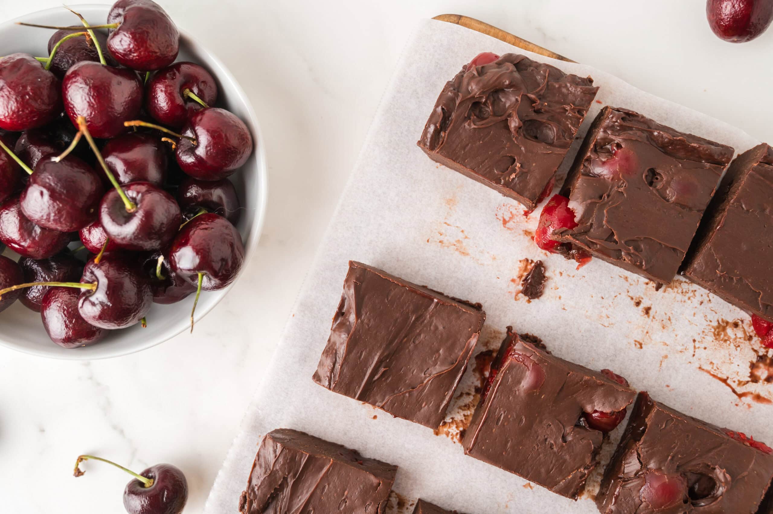 Dark cherry fudge cut into squares and and ready to be enjoyed