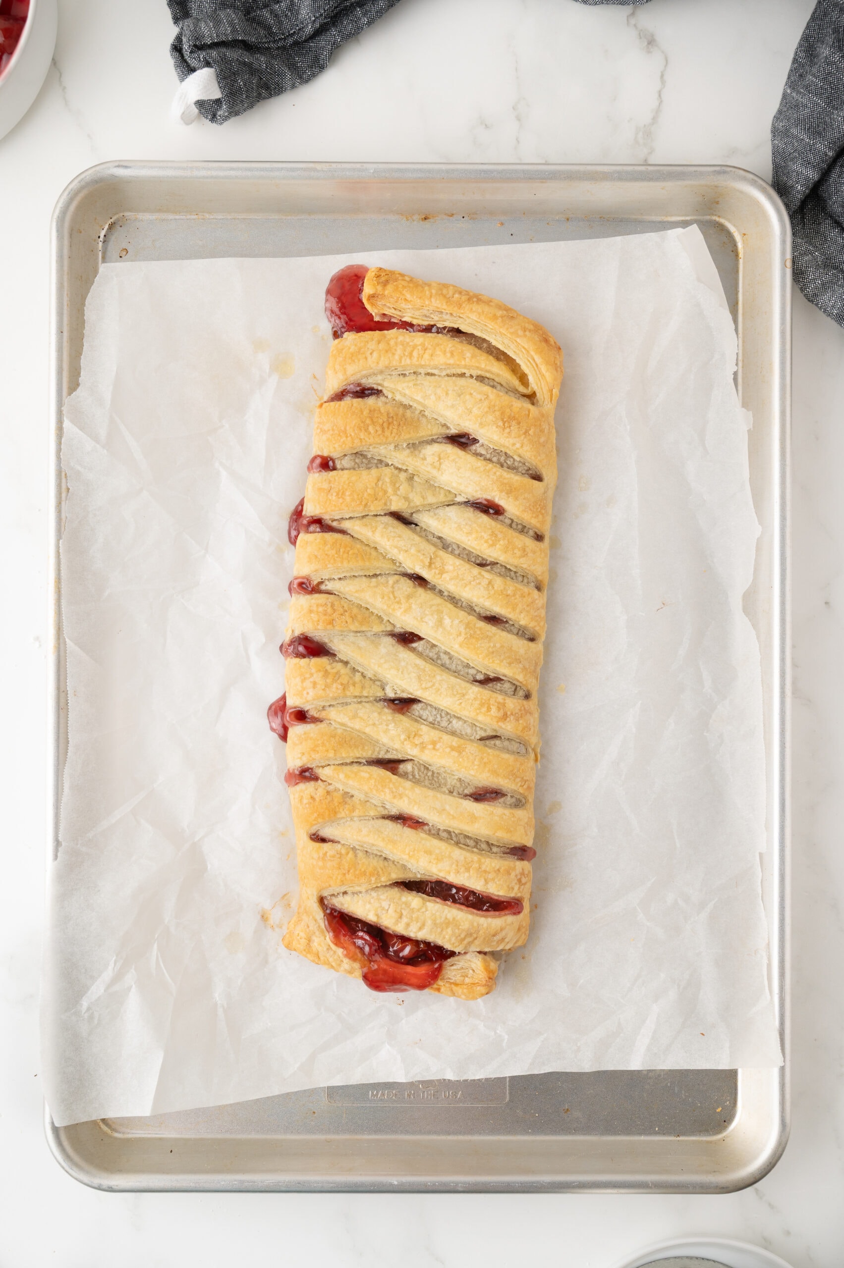 Freshly baked puff pastry cherry strudel