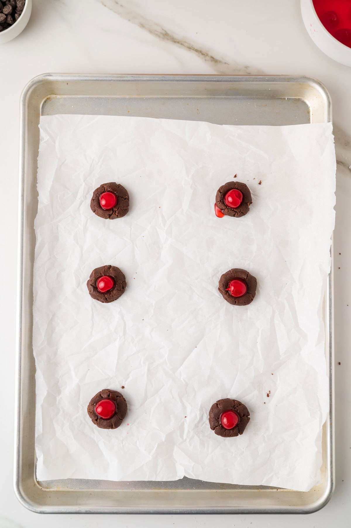 place one maraschino cherry with no stem in each well