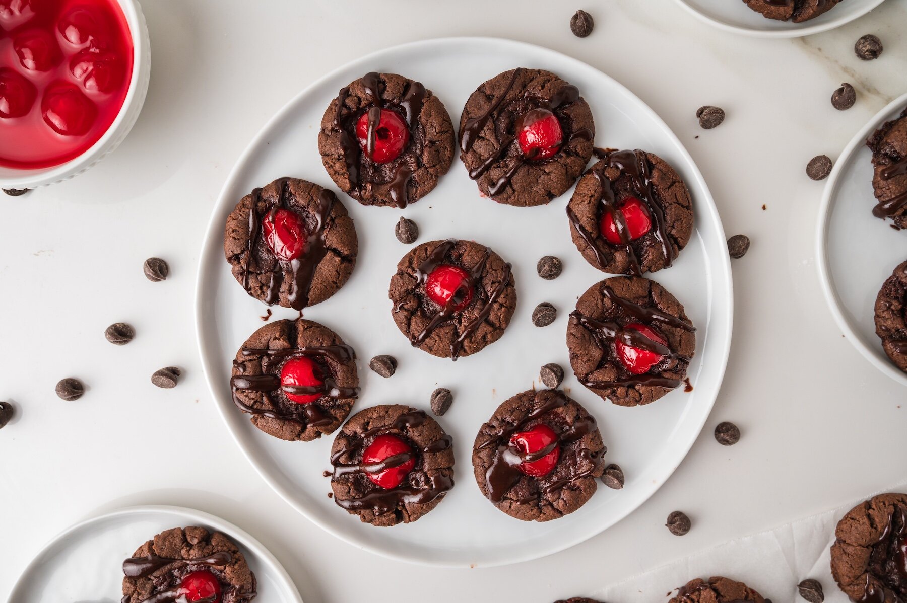 a plate of Chocolate Covered Cherry Cookies with chocolate chips