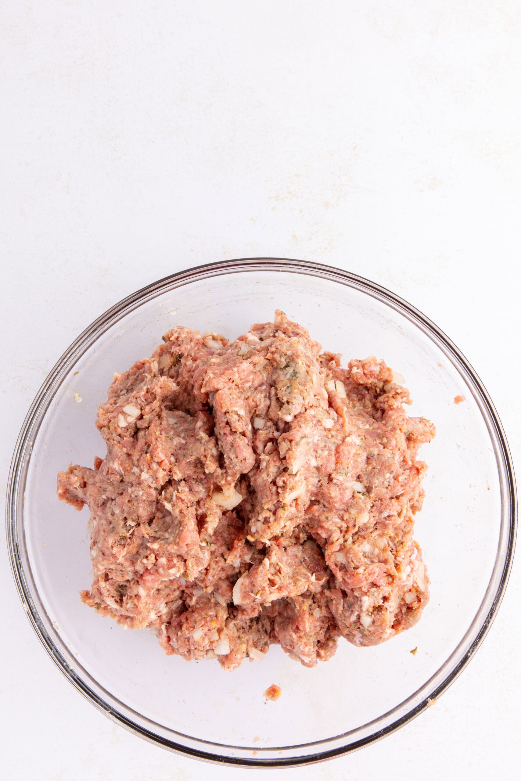 The meatball mixture is all mixed up with all the ingredients, ready to create the meatballs