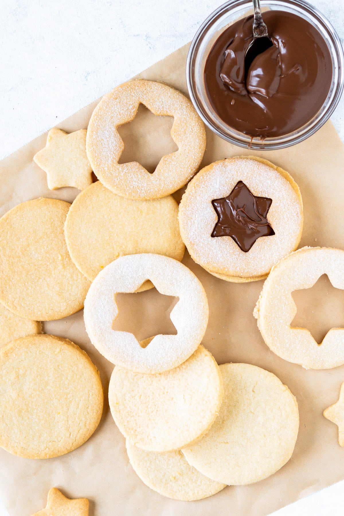 spread Nutella on half of the cookies