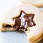 a Nutella Linzer cookie with a bite out