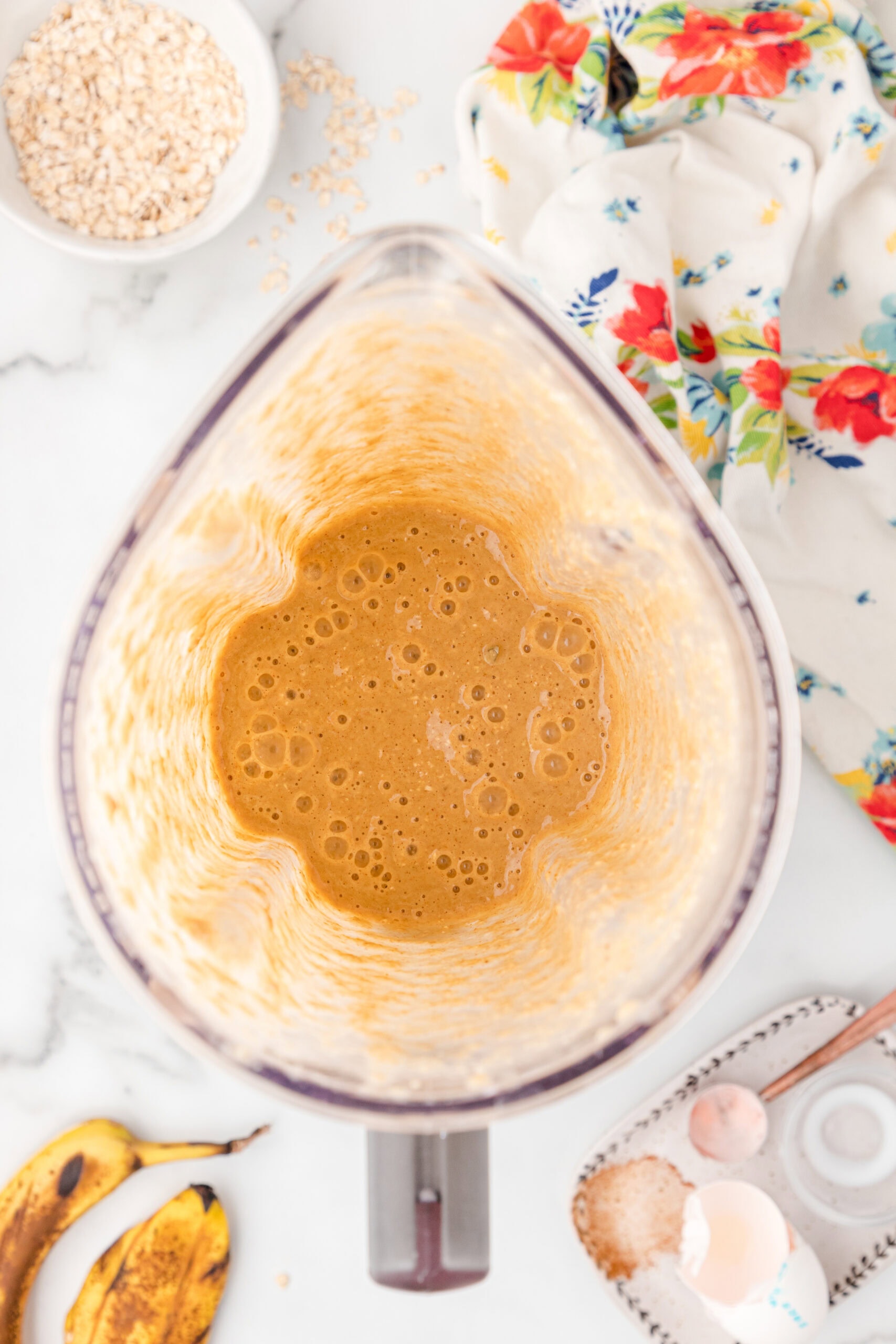 Banana protein batter is all mixed up, ready to be poured on hot skillet to make pancakes