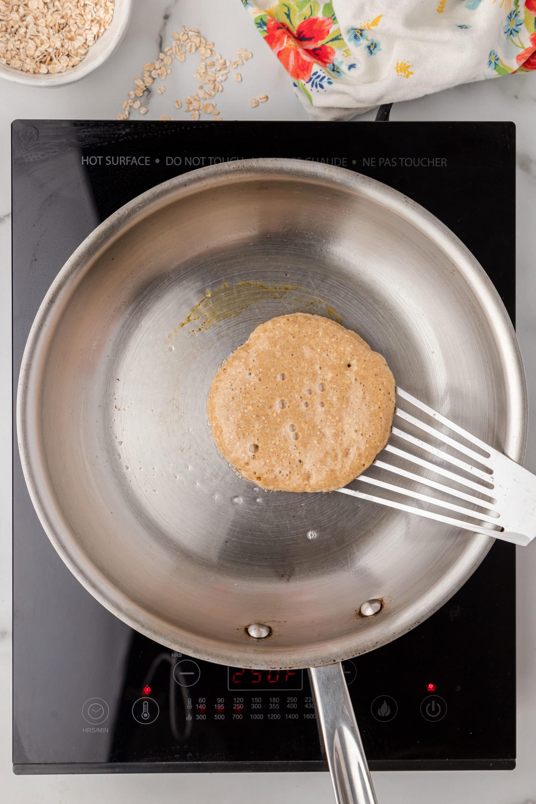 Skillet is hot, and pancake batter is ready to be cooked to create pancakes