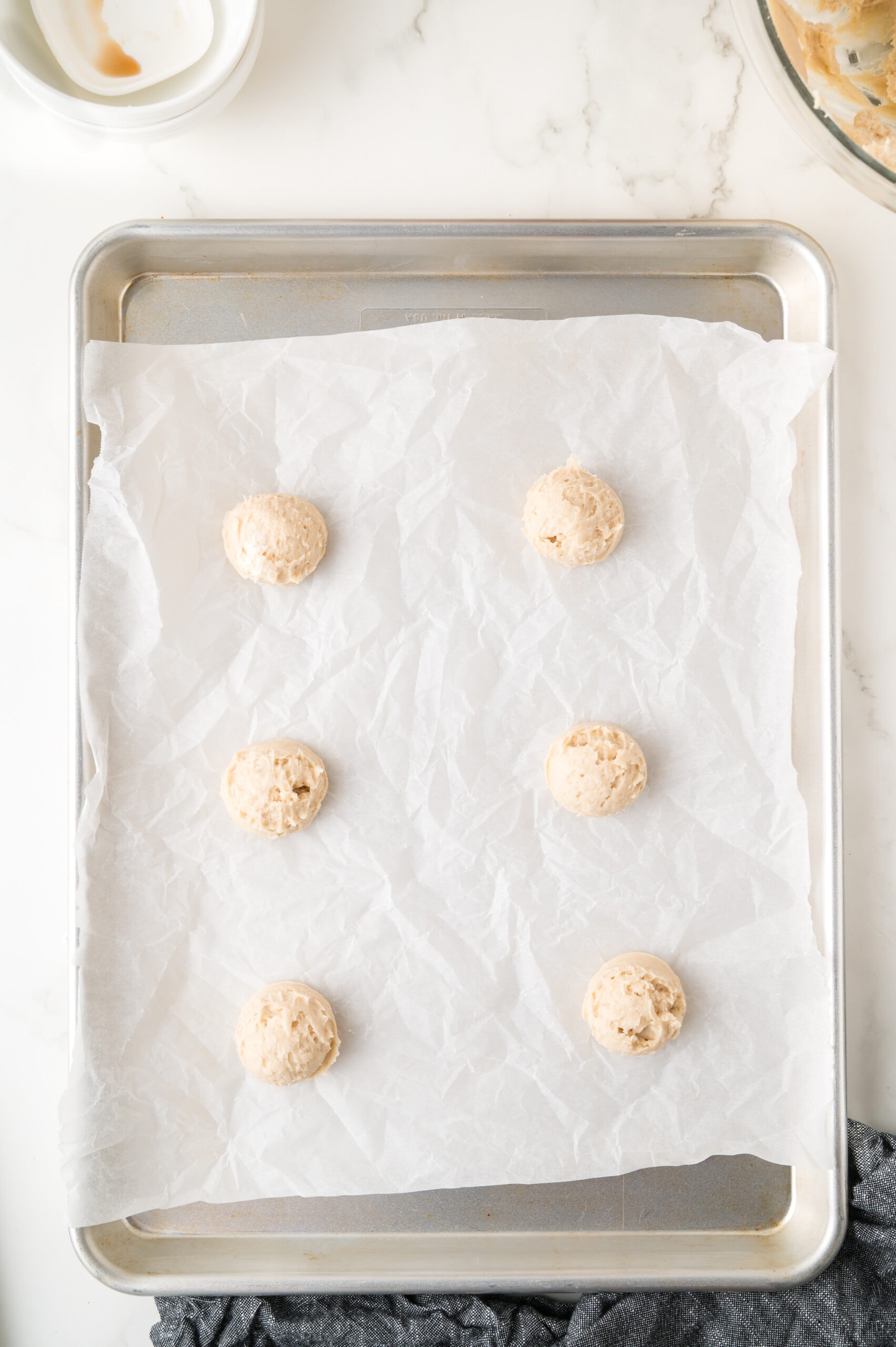 Used a cookie scoop to make even cookies, placed on a baking sheet