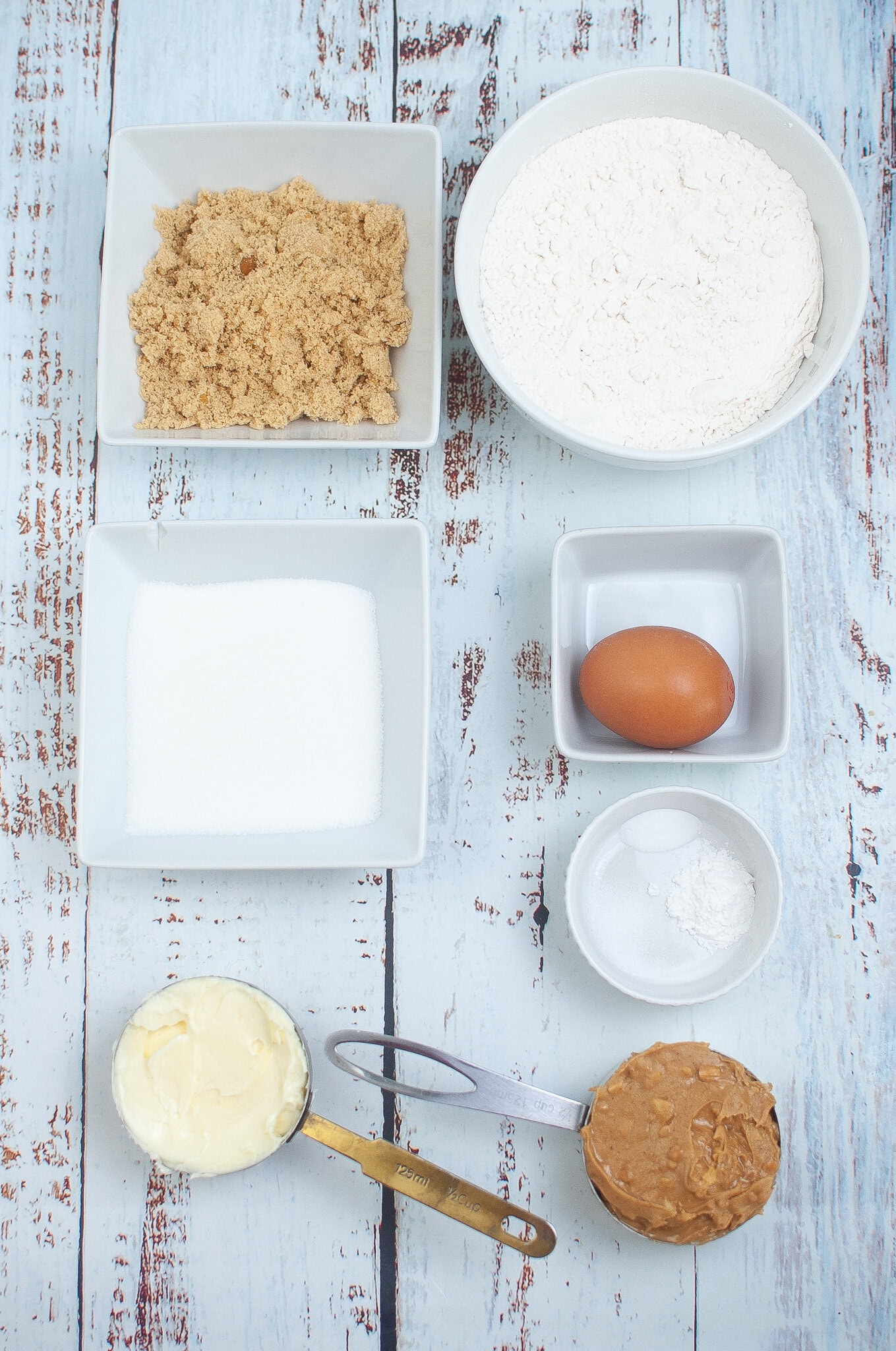 All ingredients pictured: butter, sugar, peanut butter, flour, baking soda & powder, salt