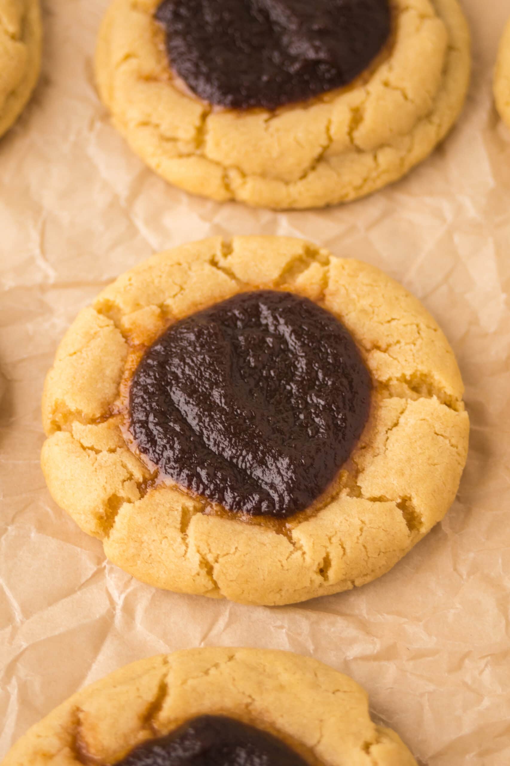 Close up of several apple thumbprint cookies, showing its texture