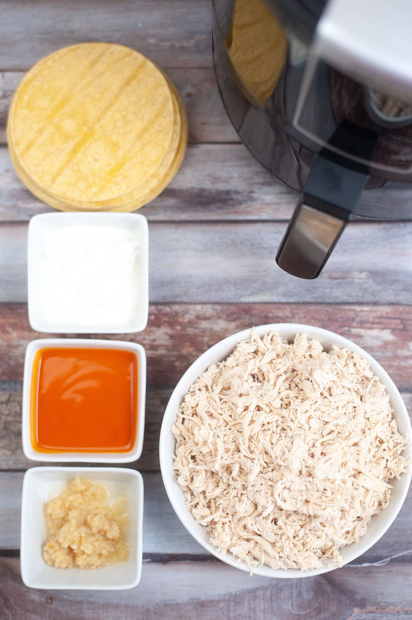 All ingredients pictured to make air fryer buffalo chicken taquitos