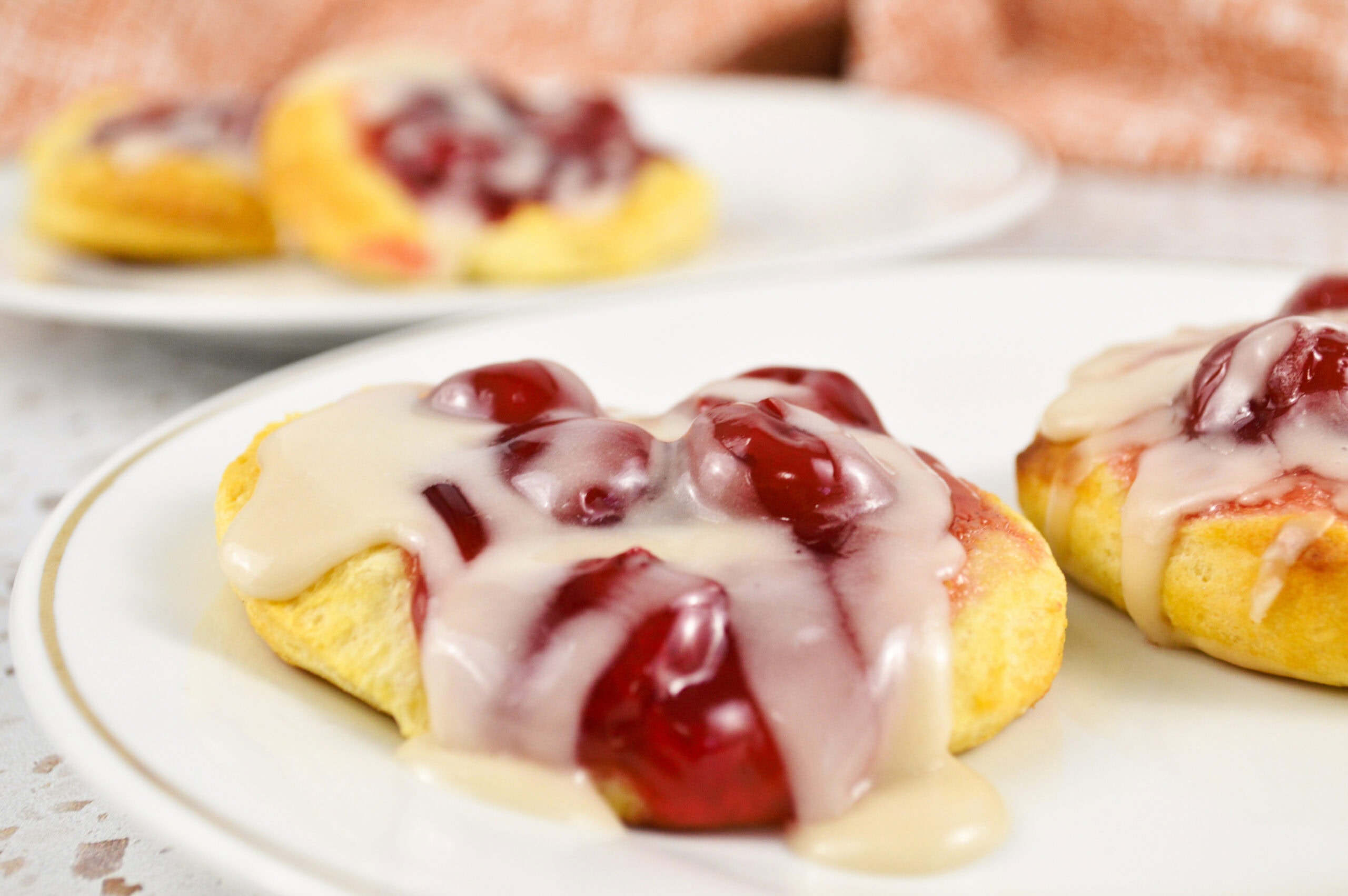 Air fryer cherry danish with homemade almond glaze ready to be served