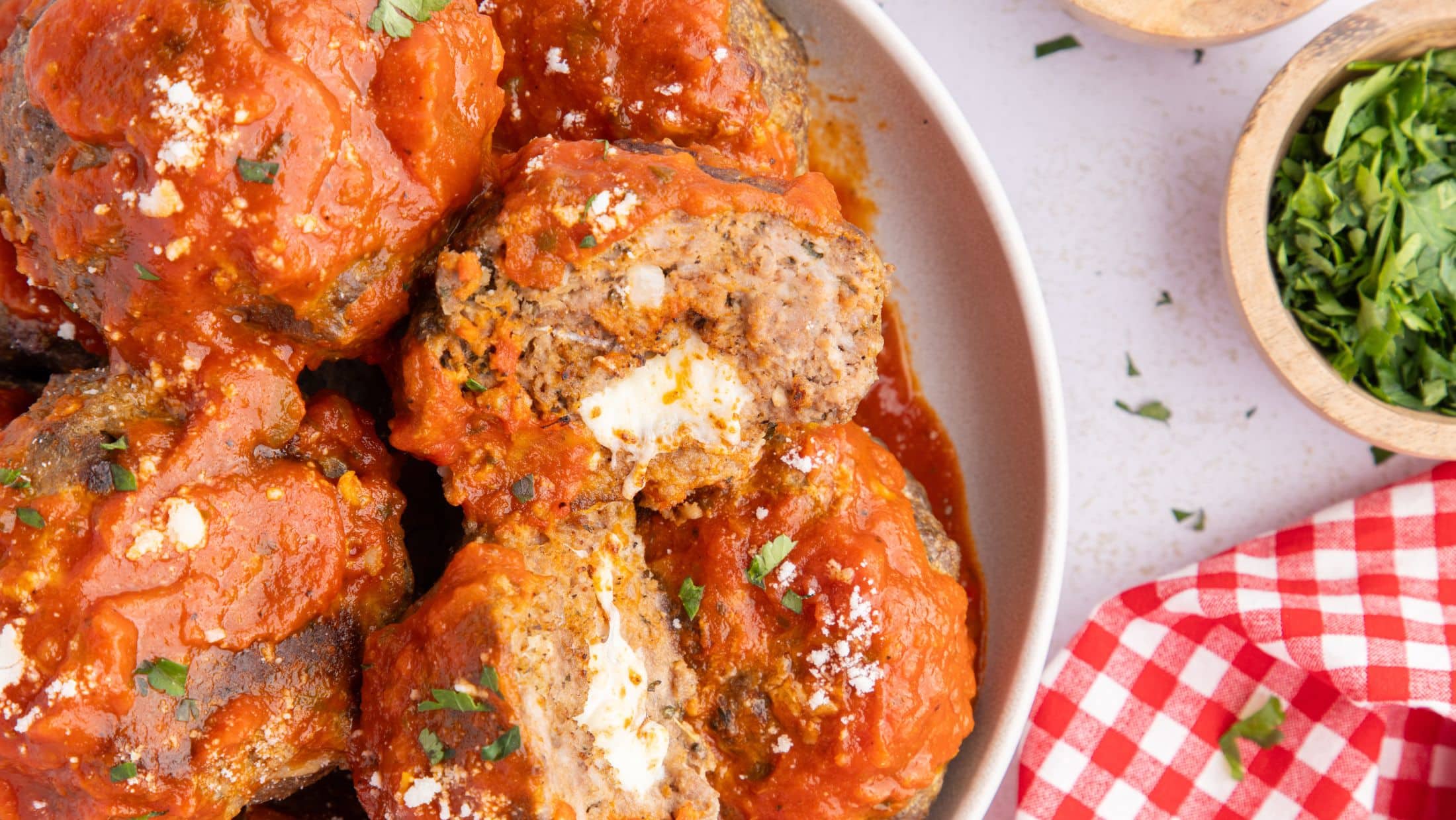 Close up of the finished baked mozzarella stuffed meatballs
