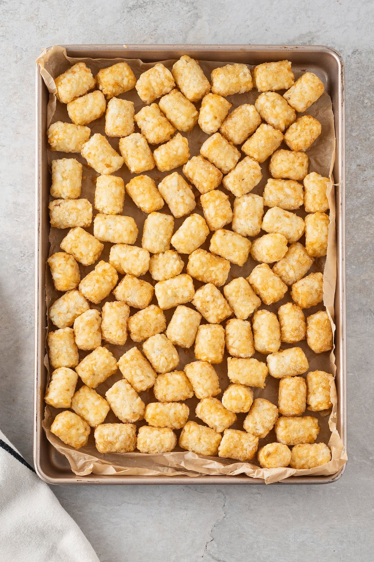 spread the tater tots on a baking sheet lined with parchment or foil