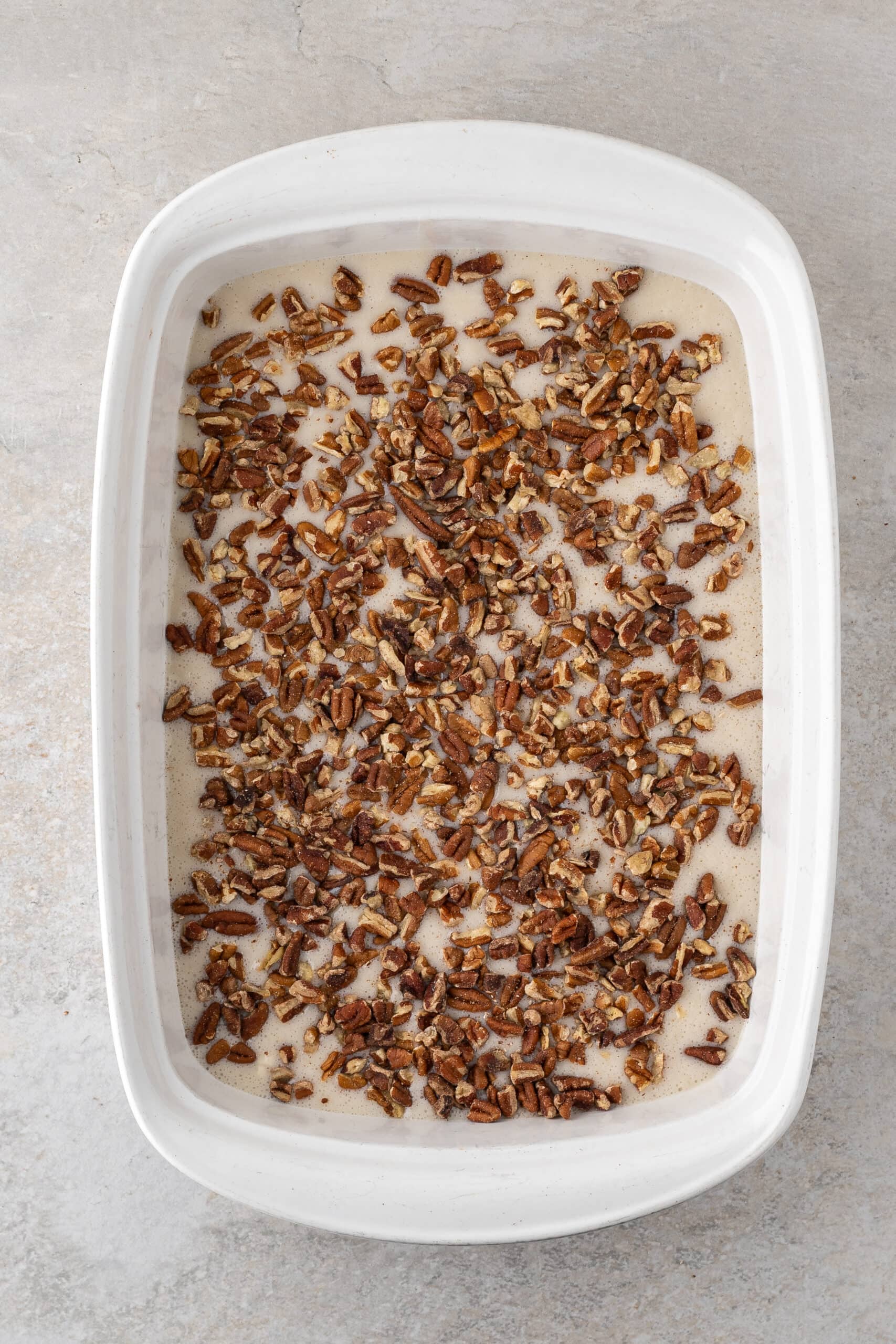 Pecan pie cobbler process of adding pecans to the batter