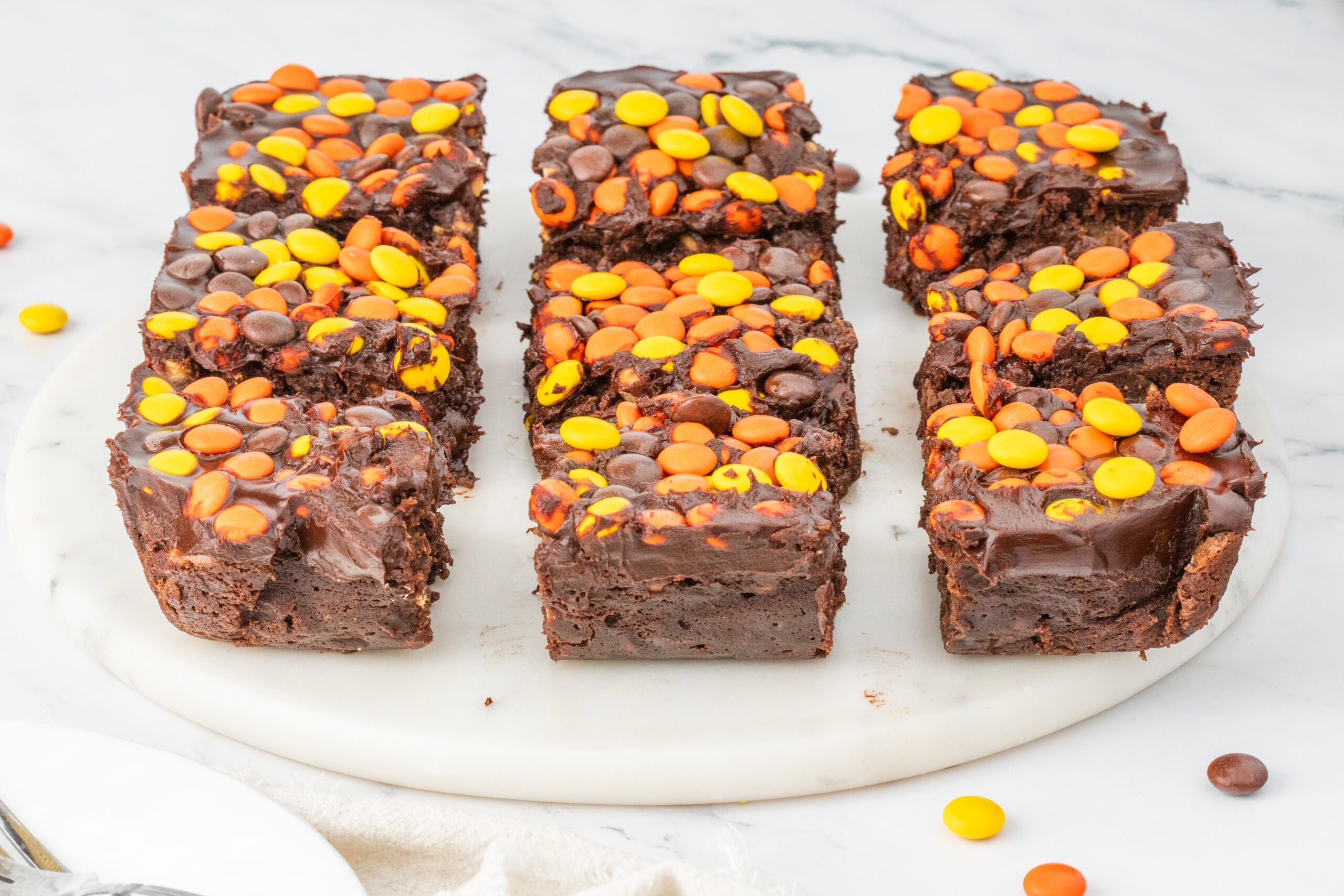 Reese's Pieces brownies cut into squares.