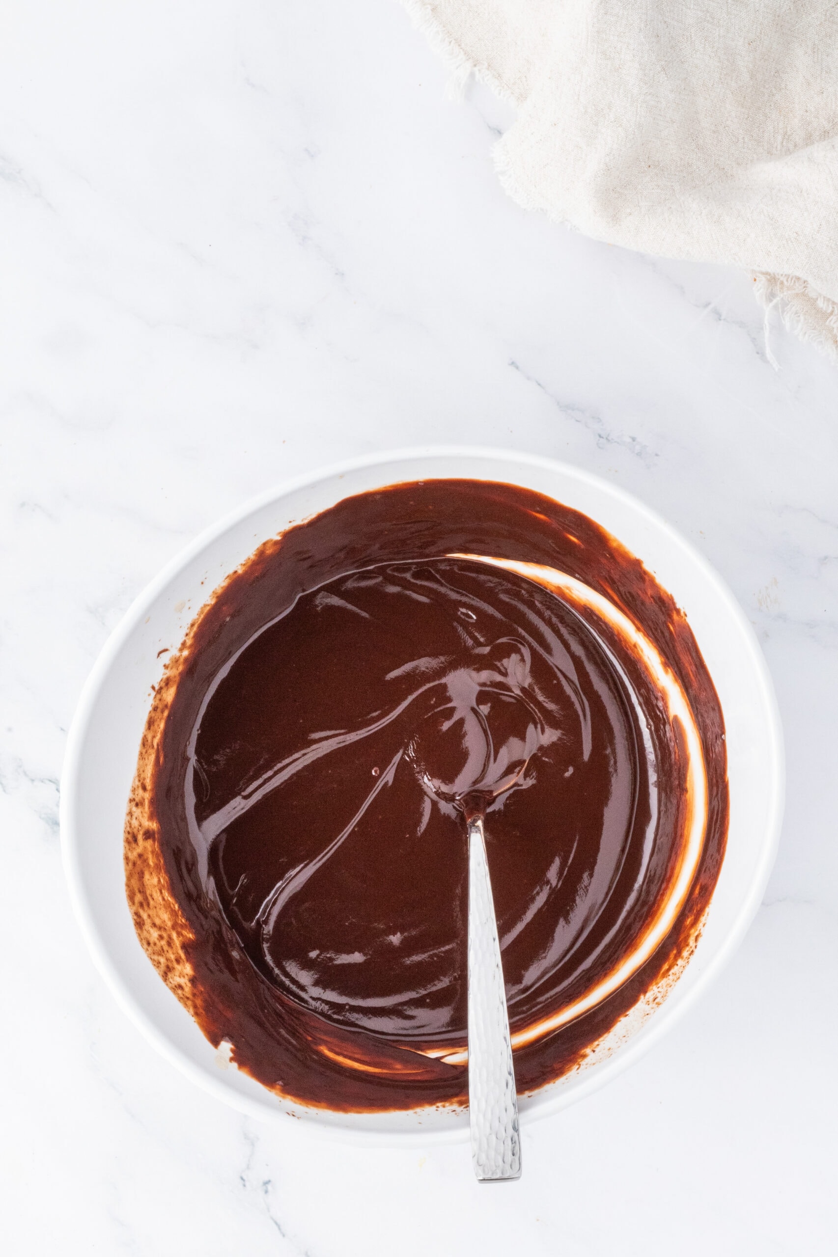 A finished process shot of the chocolate ganache that will go on top of the brownies