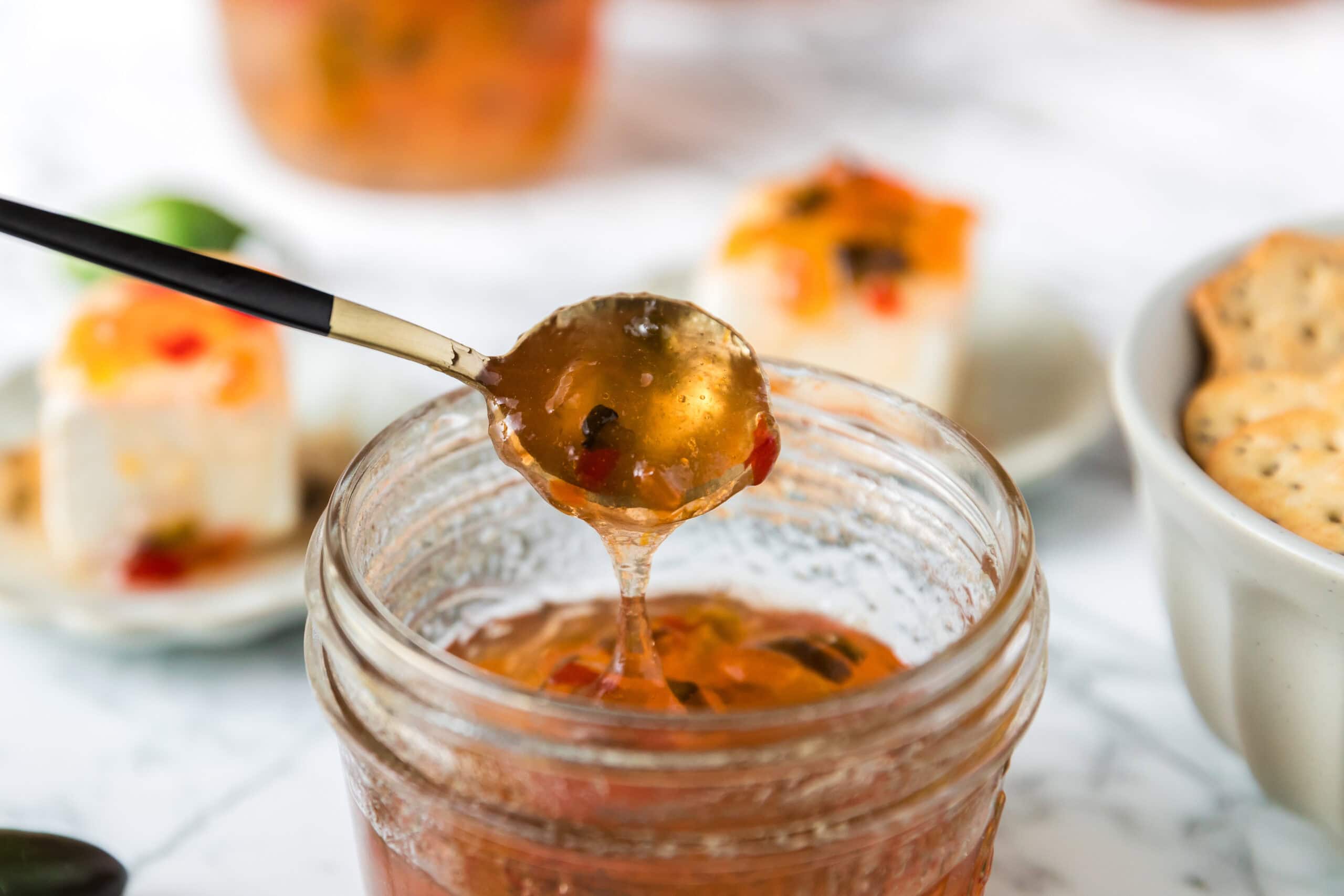 Scooped up pepper jelly with a spoon