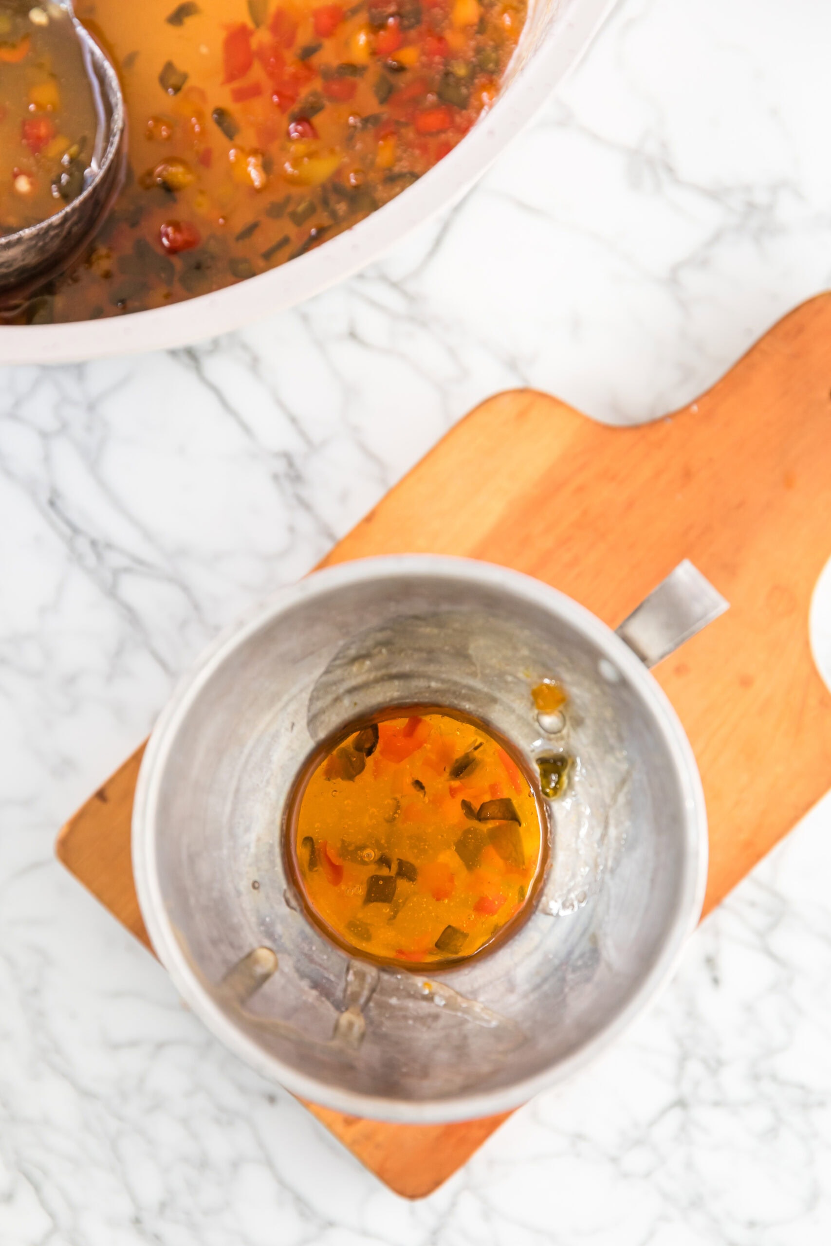 Process of creating hot pepper jelly in a mixing bowl