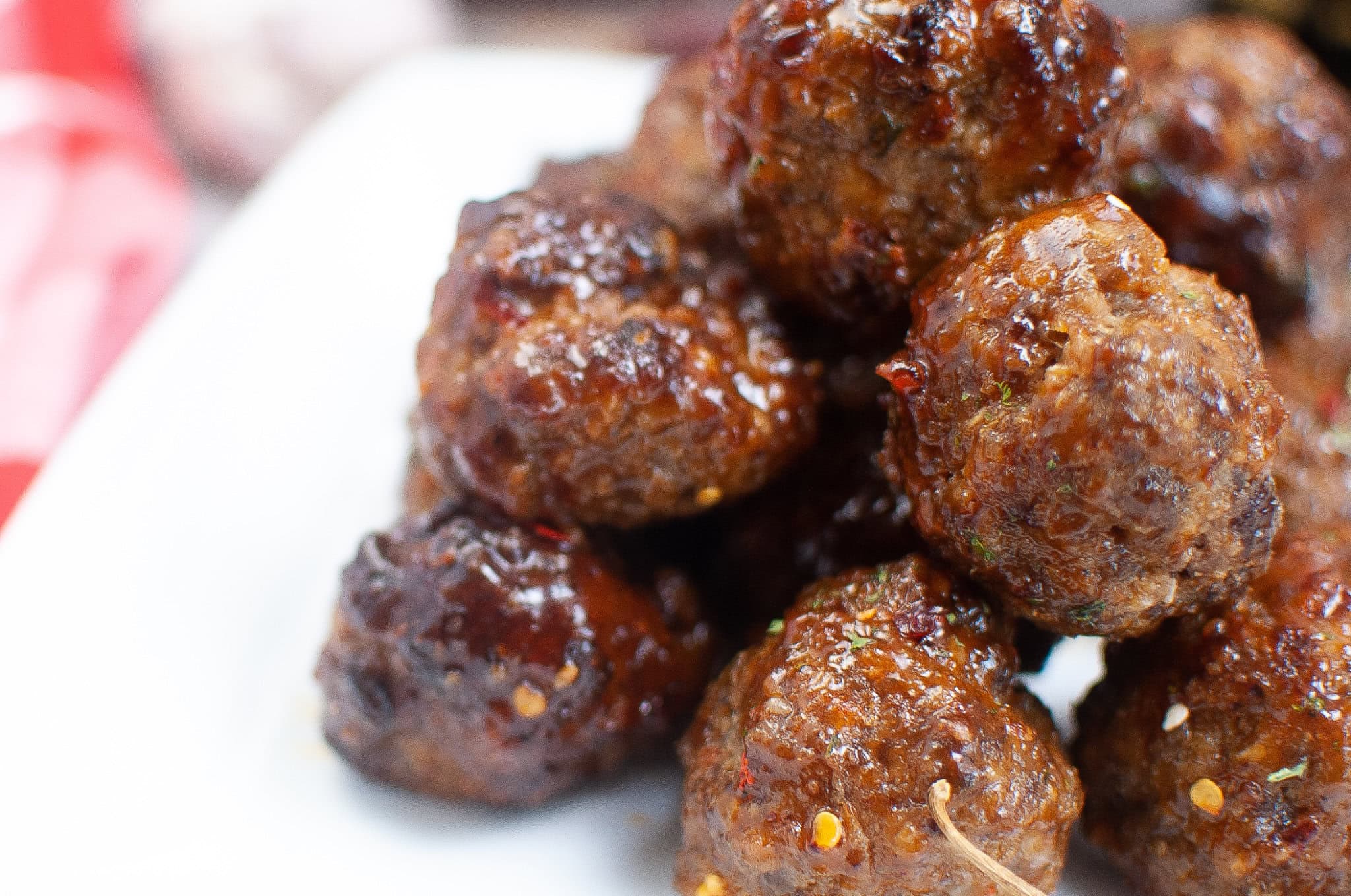 Meatballs all air fried with firecracker sauce on a plate