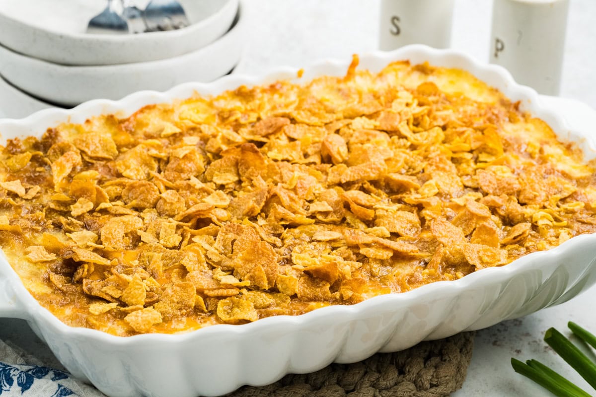 Baking dish with cheesy potatoes all baked and ready to be served