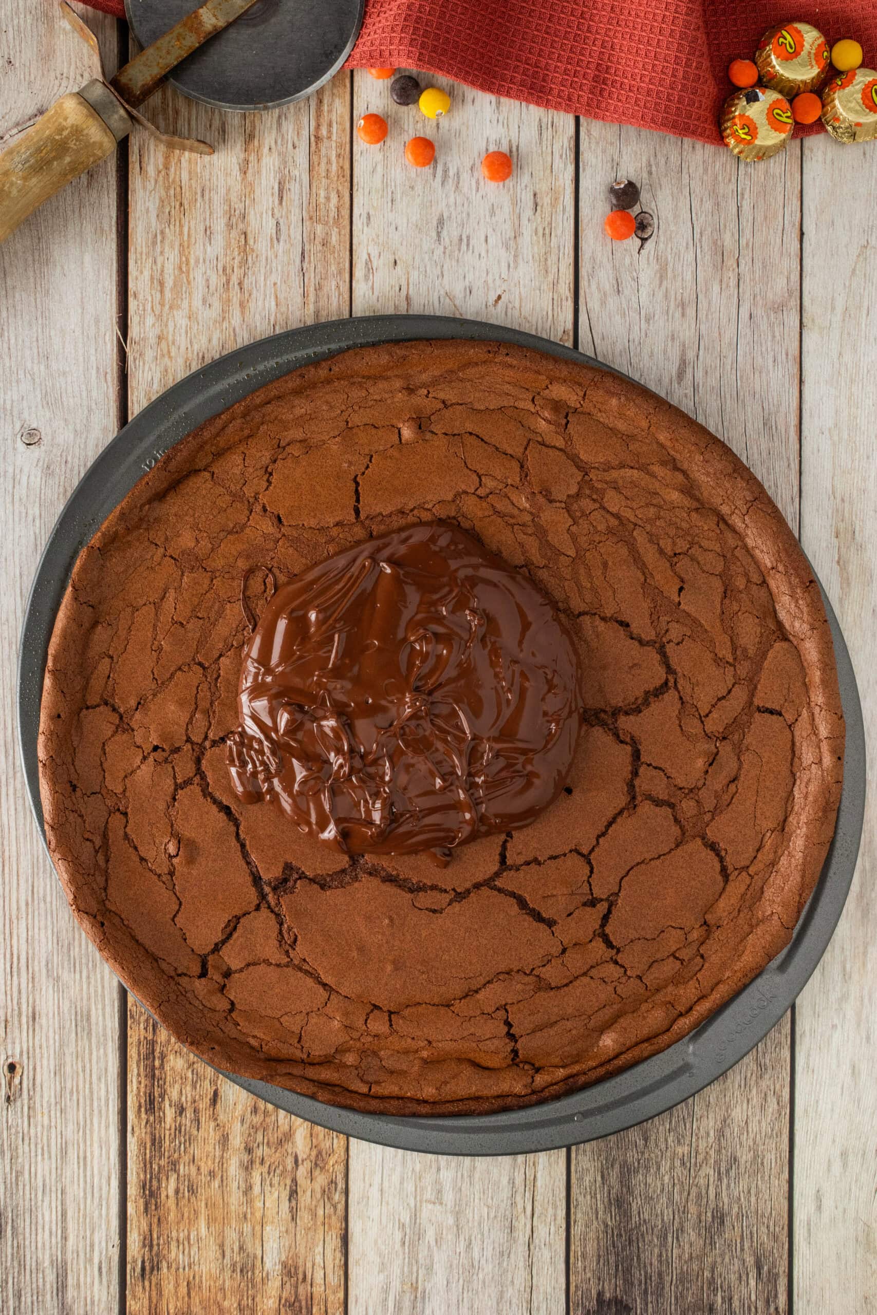 Ganache is made and placed on top of brownie, ready to be spread to the edges