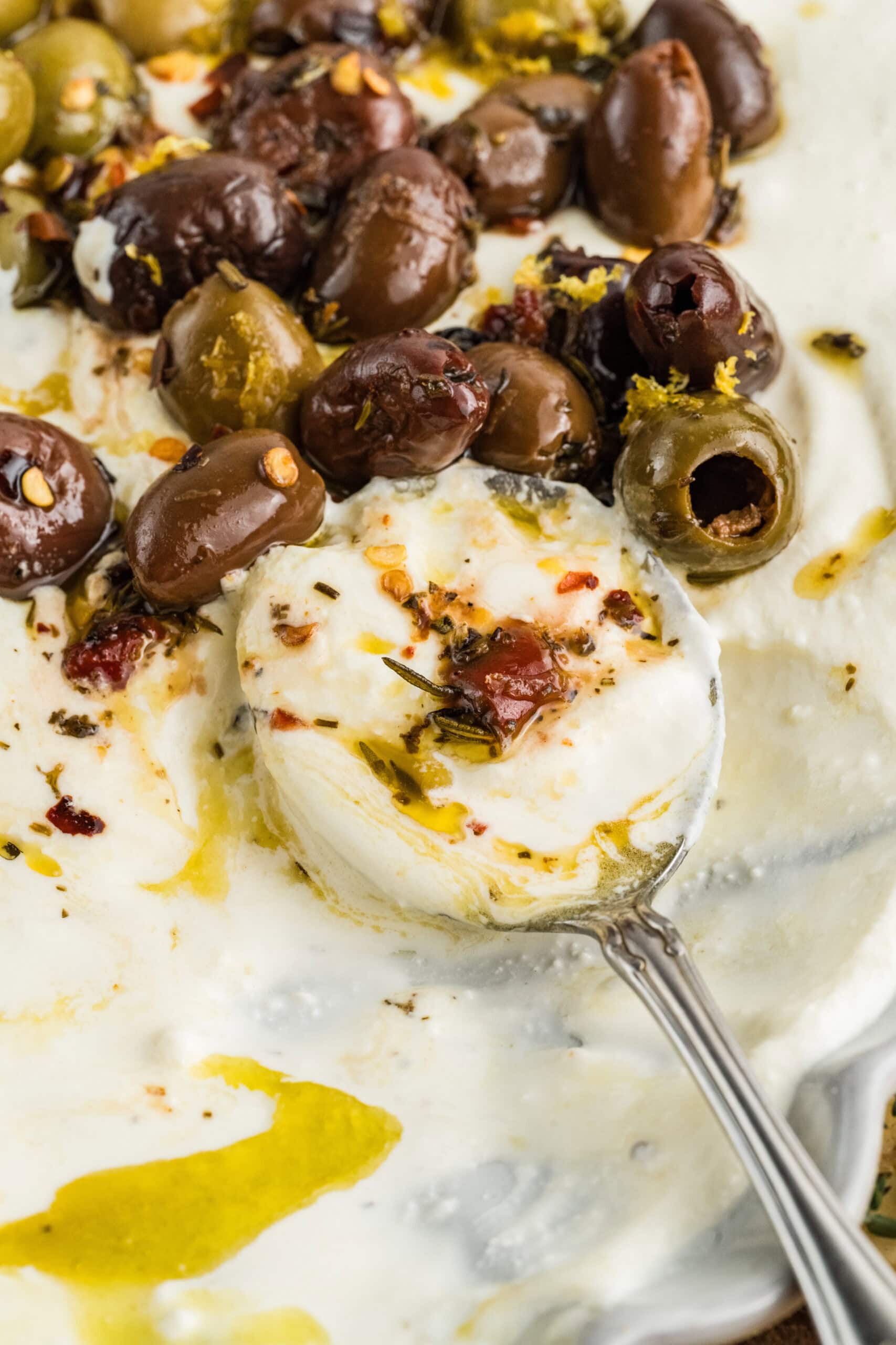 Spoonful of whipped feta with oil.