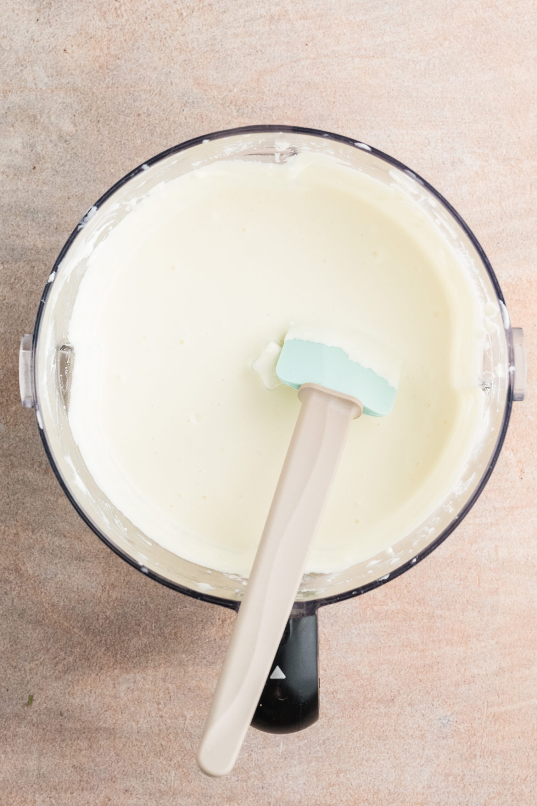 In a food processor the feta cheese, greek yogurt, lemon juice, oil, and garlic is well mixed, whipped.