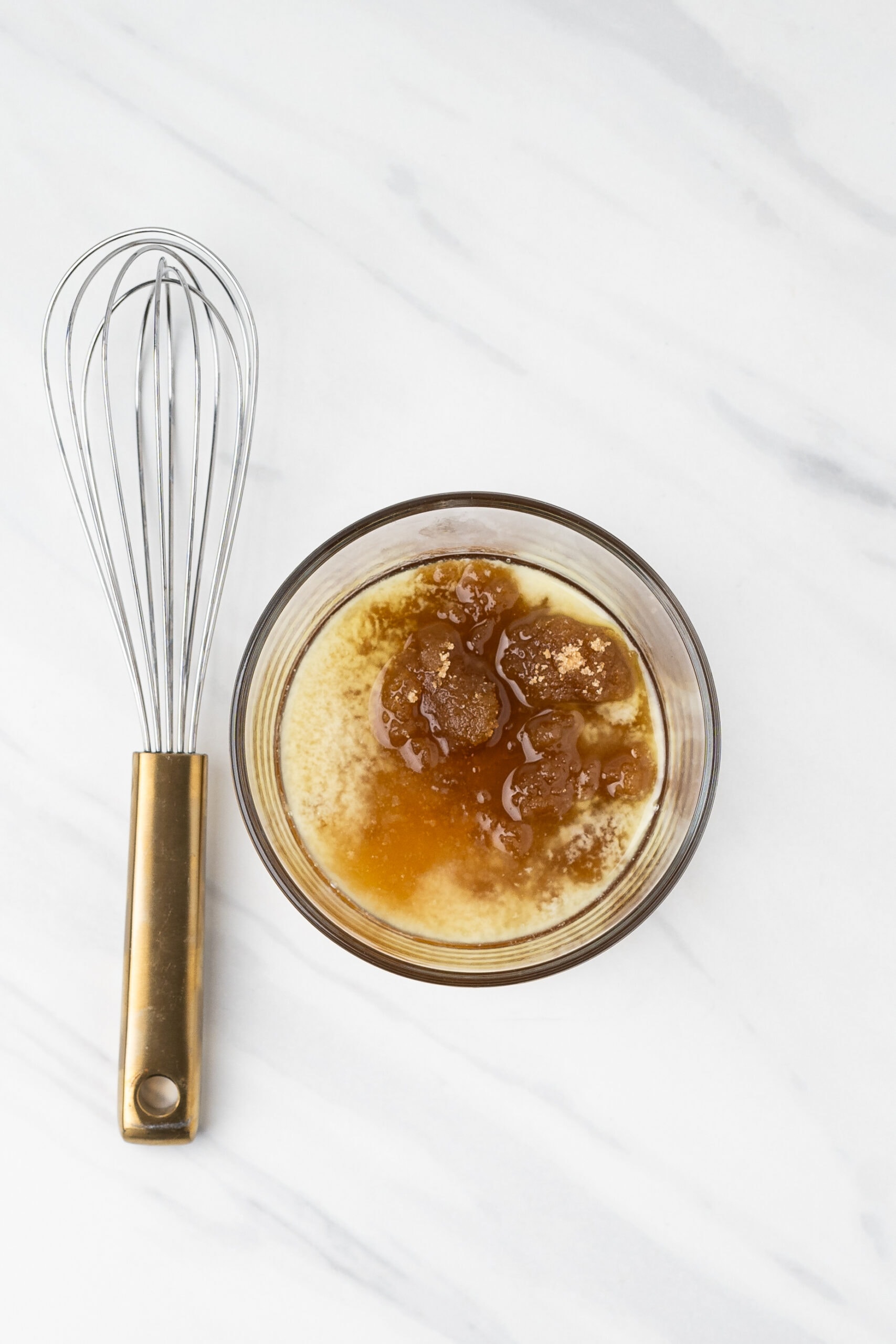 Brown sugar, honey, olive oil to melted butter in a glass bowl