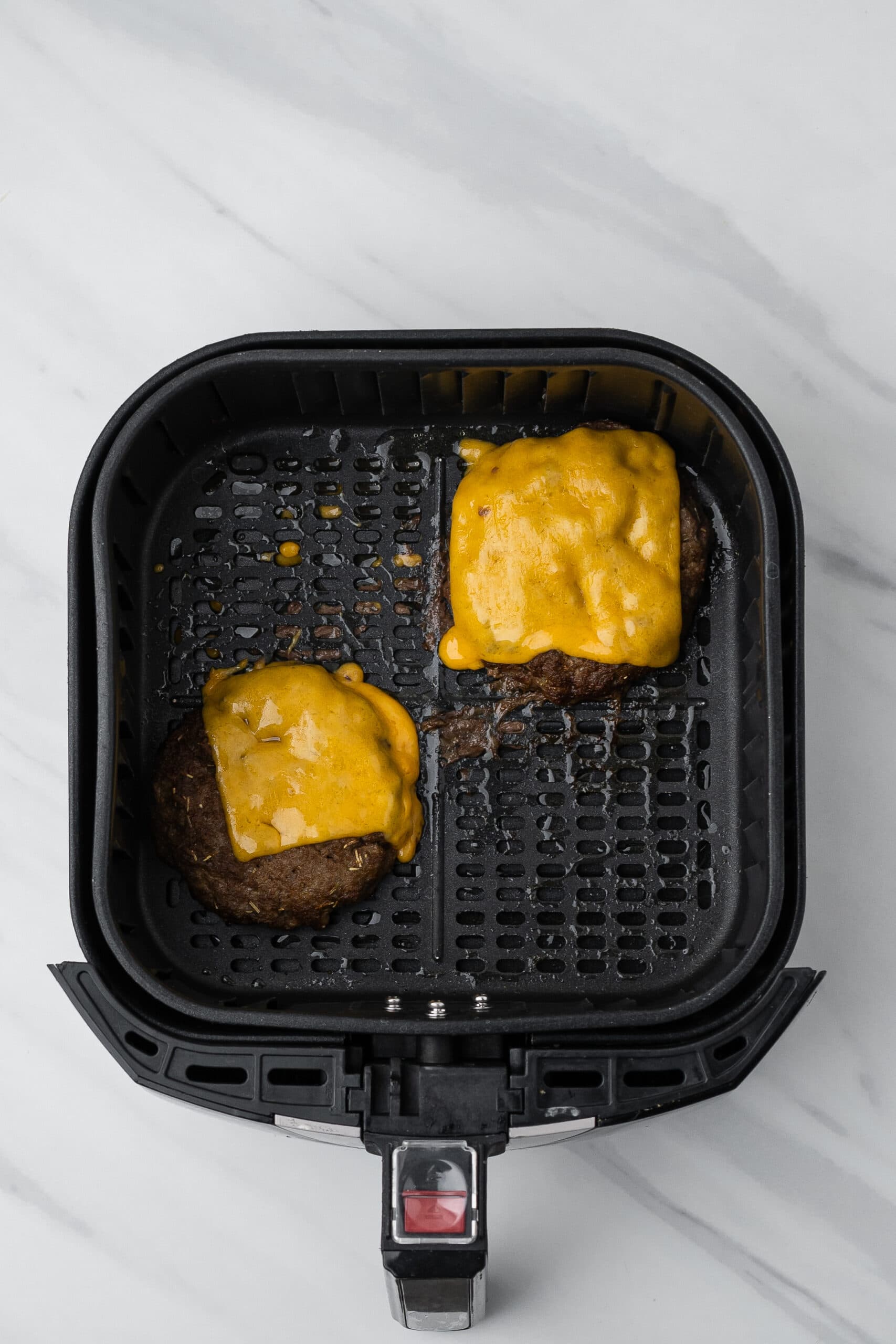 Turkey air fryer burgers with melted cheese in the air fryer
