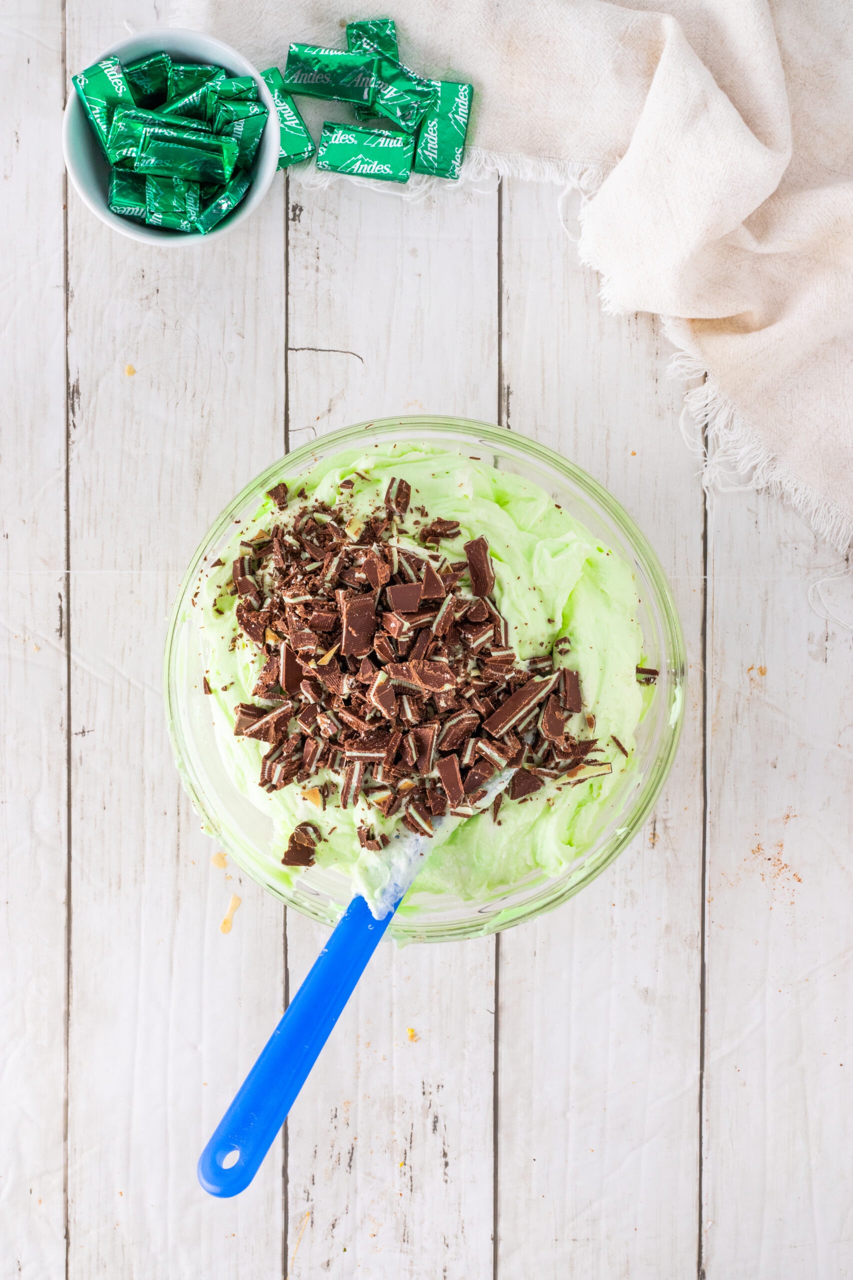 Adding cut up andes mints to cheesecake batter
