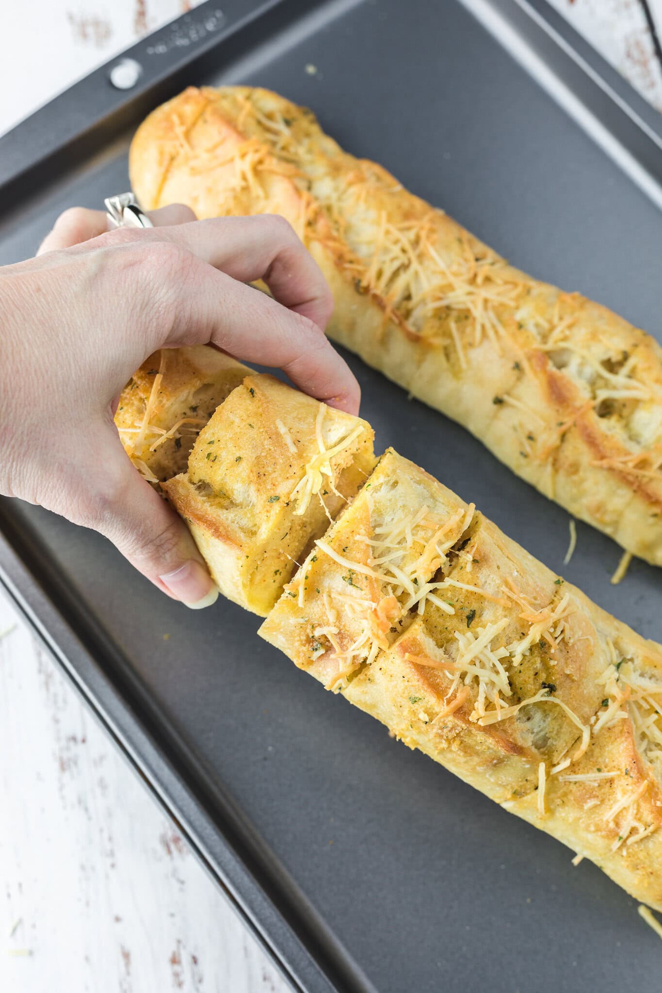 Showing the middle of the cheesy garlic bread, showing the melted cheese