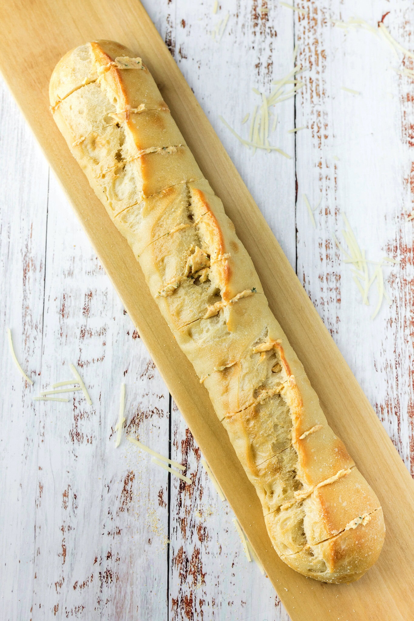 Cheesy garlic bread, cut in slices, butter mixture inside each slice