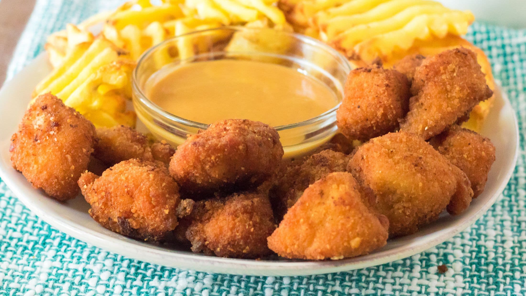 Chick Fil A sauce all mixed and ready to serve next to Chick Fil A nuggests