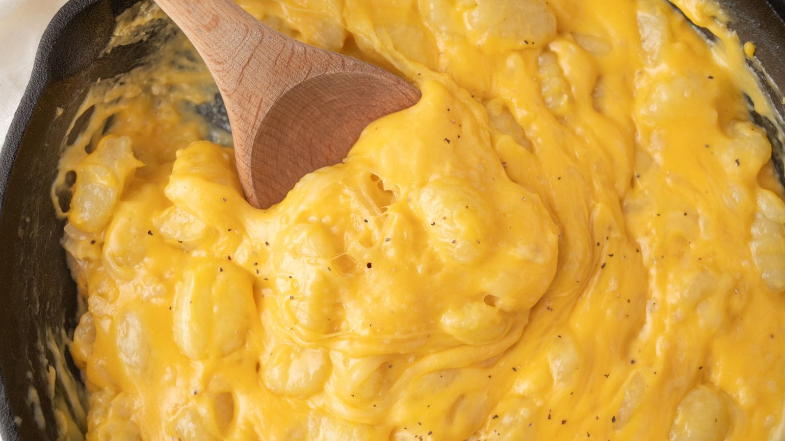 gnocchi mac and cheese with a wooden spoon