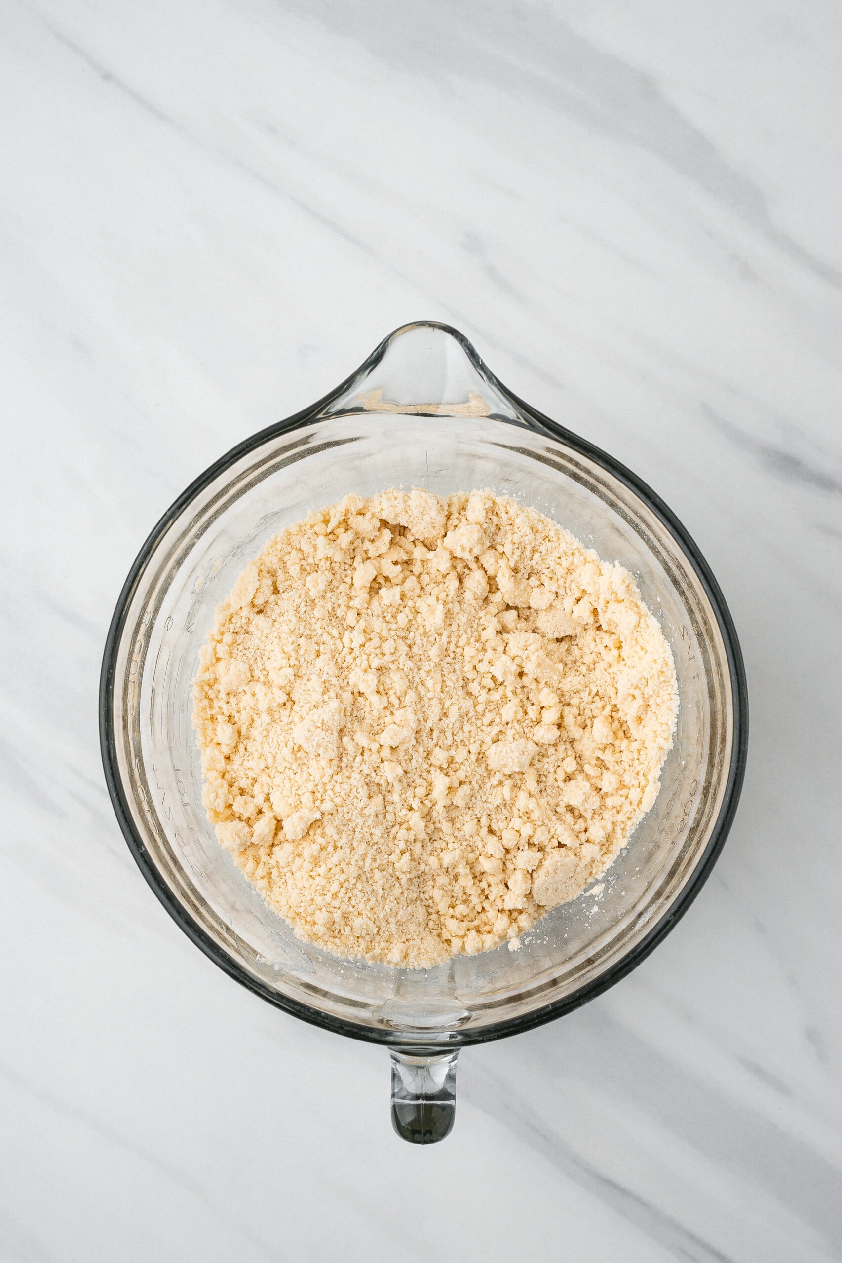 Mixing bowl with flour, sugar, softened butter, ready to place on a baking sheet to make the shortbread crust