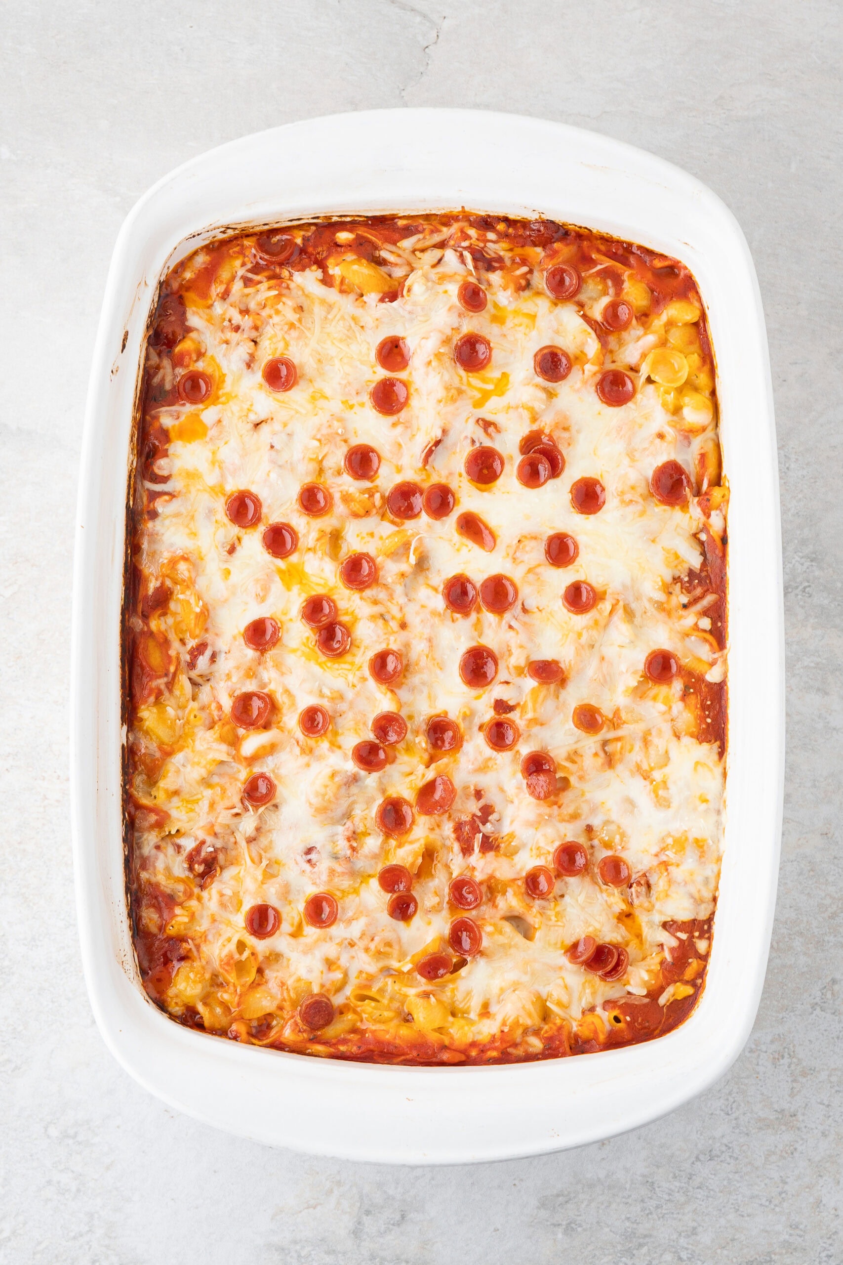 The finished baked pepperoni pizza mac and cheese, all warm and cheesy, ready to be cooled and served