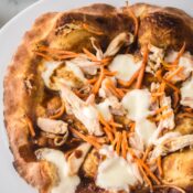 Close up baked Thai chicken pizza, to see all the ingredients and textures