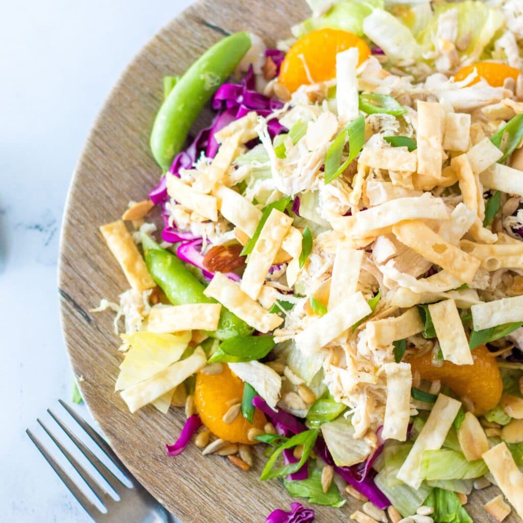 Close up of chicken salad on a plate with a fork