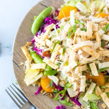 Close up of chicken salad on a plate with a fork