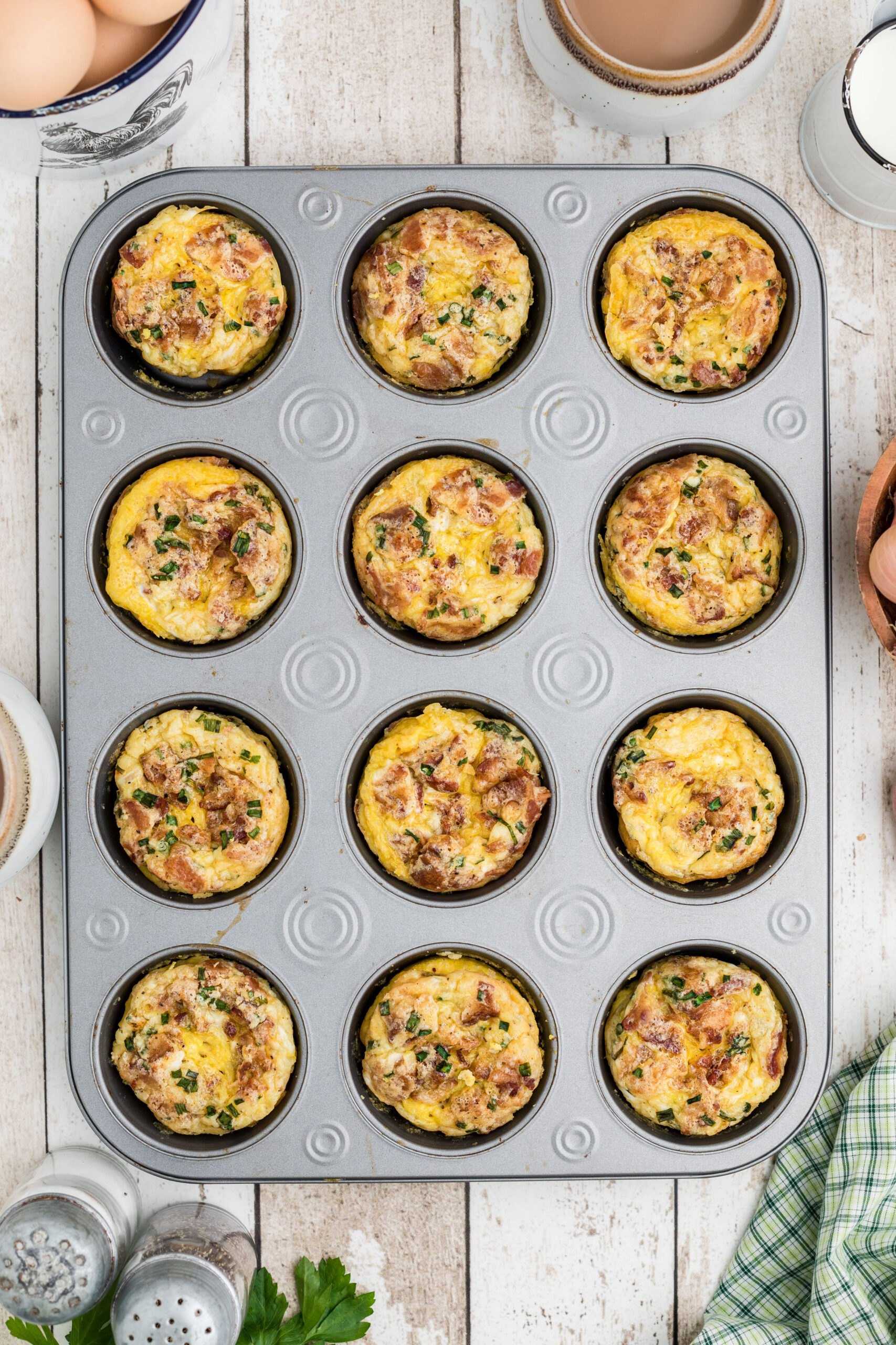 Breakfast muffins in a baking muffin tin, all baked and cooling